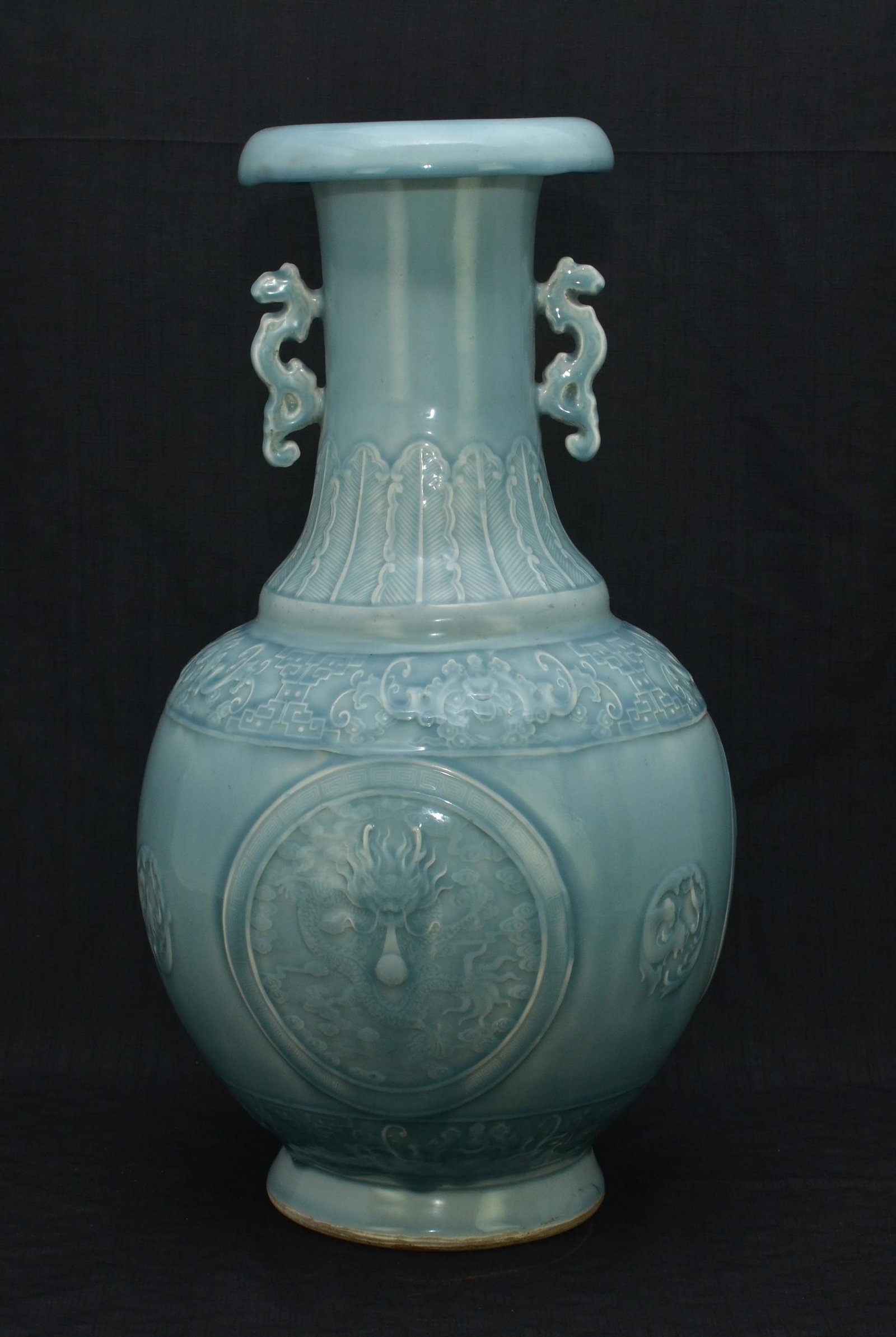 Chineses Double Handled Porcelain Vase: Chinese monochrome glaze porcelain double handled vase with dragon medallions in relief, impressed mark to base, 21-7/8Ã¯Â¿½ h x 11Ã¯Â¿½ dia