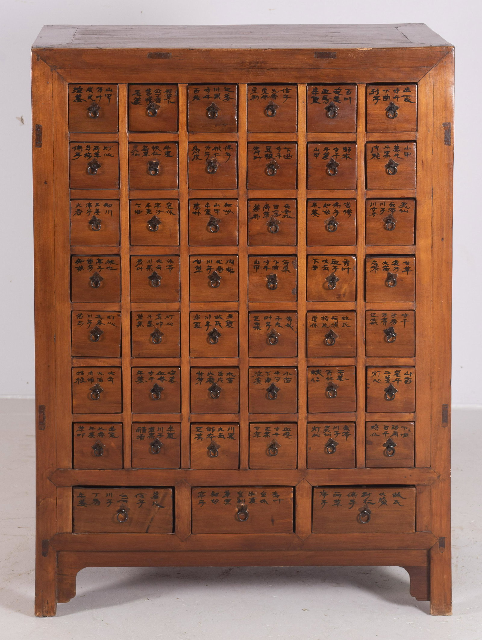 Chinese Elmwood carved apothecary cabinet: Chinese Elmwood carved apothecary cabinet, Chinese letters on drawer fronts, 46" h x 33" w