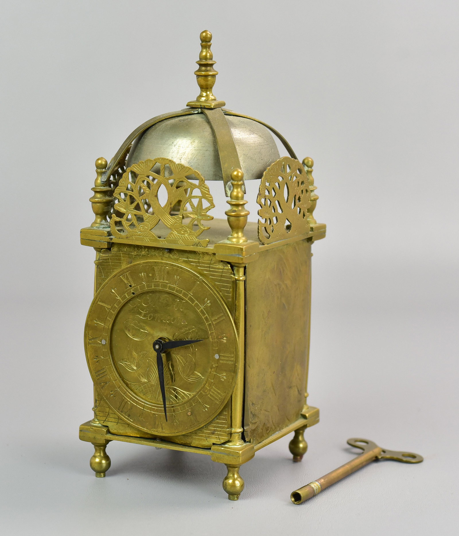 Brass Lantern Clock w/modern Movement: Brass Lantern Clock w/modern Movement, dial signed J Elliot London, 9 1/4" h, sliding access door at rear