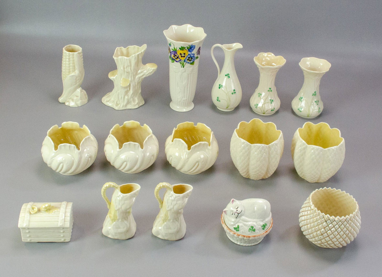(16) Pcs Belleek Porcelain: (16) Pcs Belleek porcelain, c/o cat box, treasure chest box, ear of corn vase, figural pitchers, vases, tallest 8"