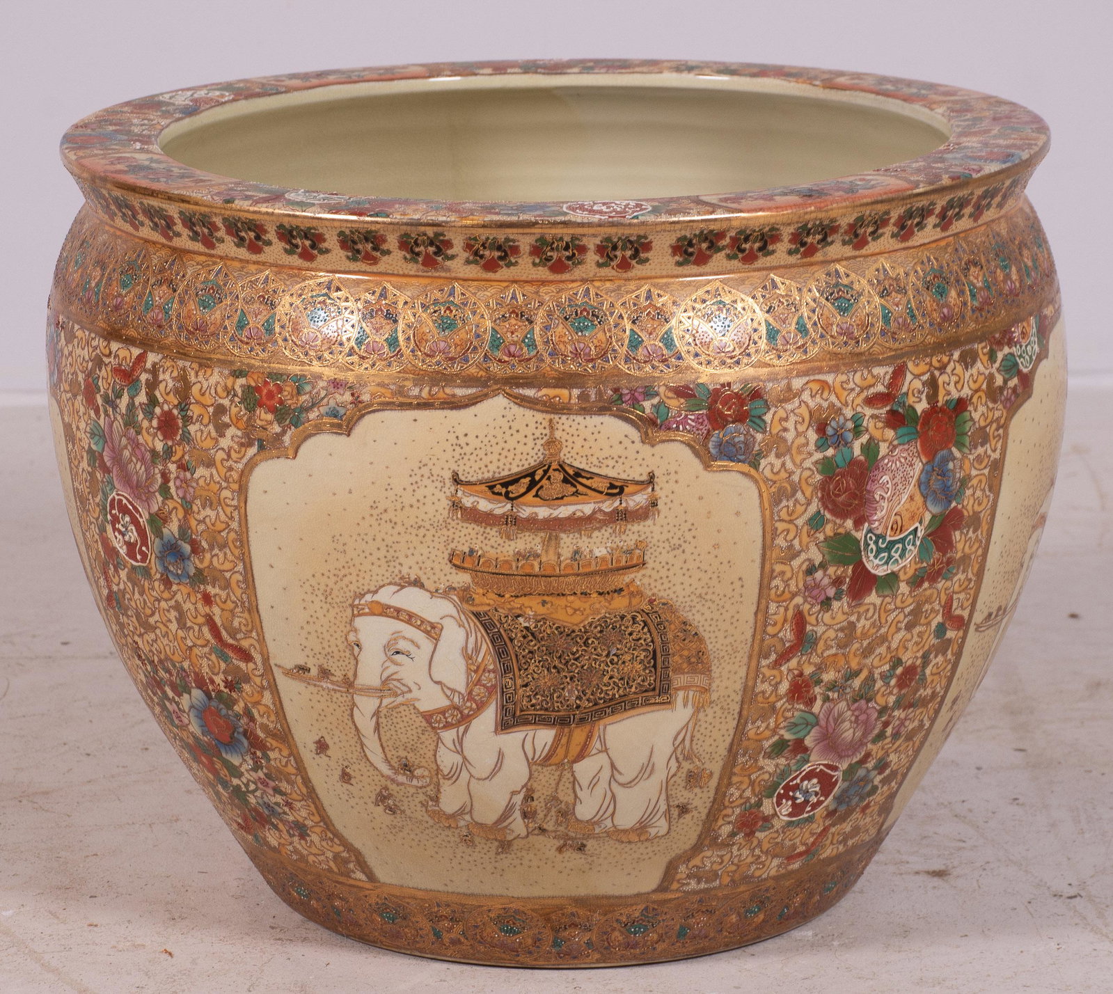 Japanese Satsuma Porcelain Fish Bowl: Japanese Satsuma porcelain fish bowl, elephant decoration on exterior, koi fish decoration on interior, Ã¯Â¿½Splendors of Meiji Treasures of Imperial Japan" mark to base, 15-1/2" h x 19-1/4