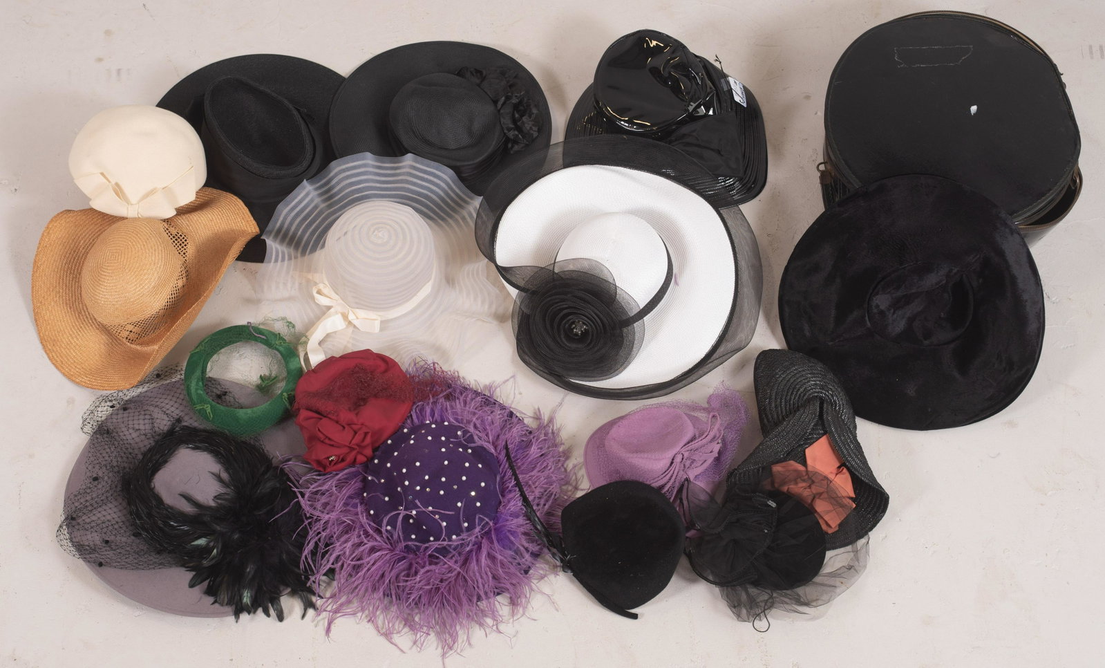 (16) 40's-80's Hat Grouping: (16) 40's-80's hat grouping to include sculptural 1940's hat with salmon silk bow, unbranded, 50's purple wool bow back hat, moth damage, (2) 1950's hats in green velvet and maroon, as is, Geo. W. Bol