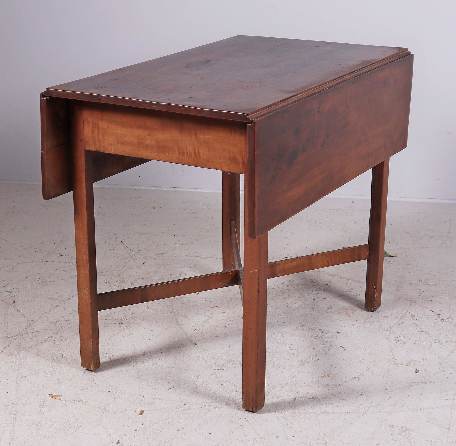 Figured maple Chippendale pembroke table: Figured maple Chippendale pembroke table with cross stretcher base, 33"l x 19-1/2"w, with 9" leaf, 26-1/2"h