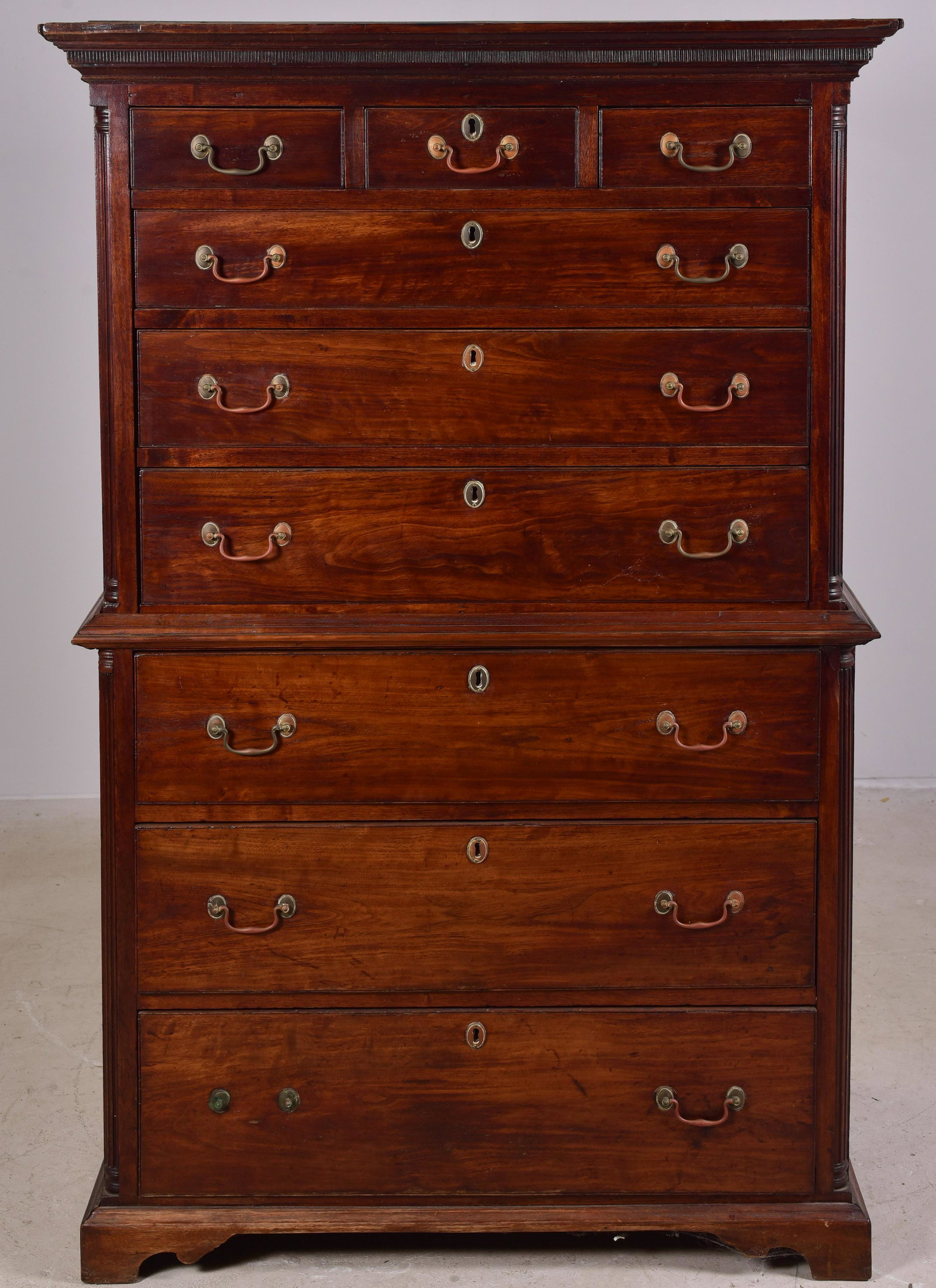 Mahogany Chippendale Chest on Chest: Mahogany Chippendale Chest on Chest, the top section with 3 short over 3 long graduated drawers, over base with 3 graduated drawers, all flanked by inset fluted quarter columns, with original brasses,