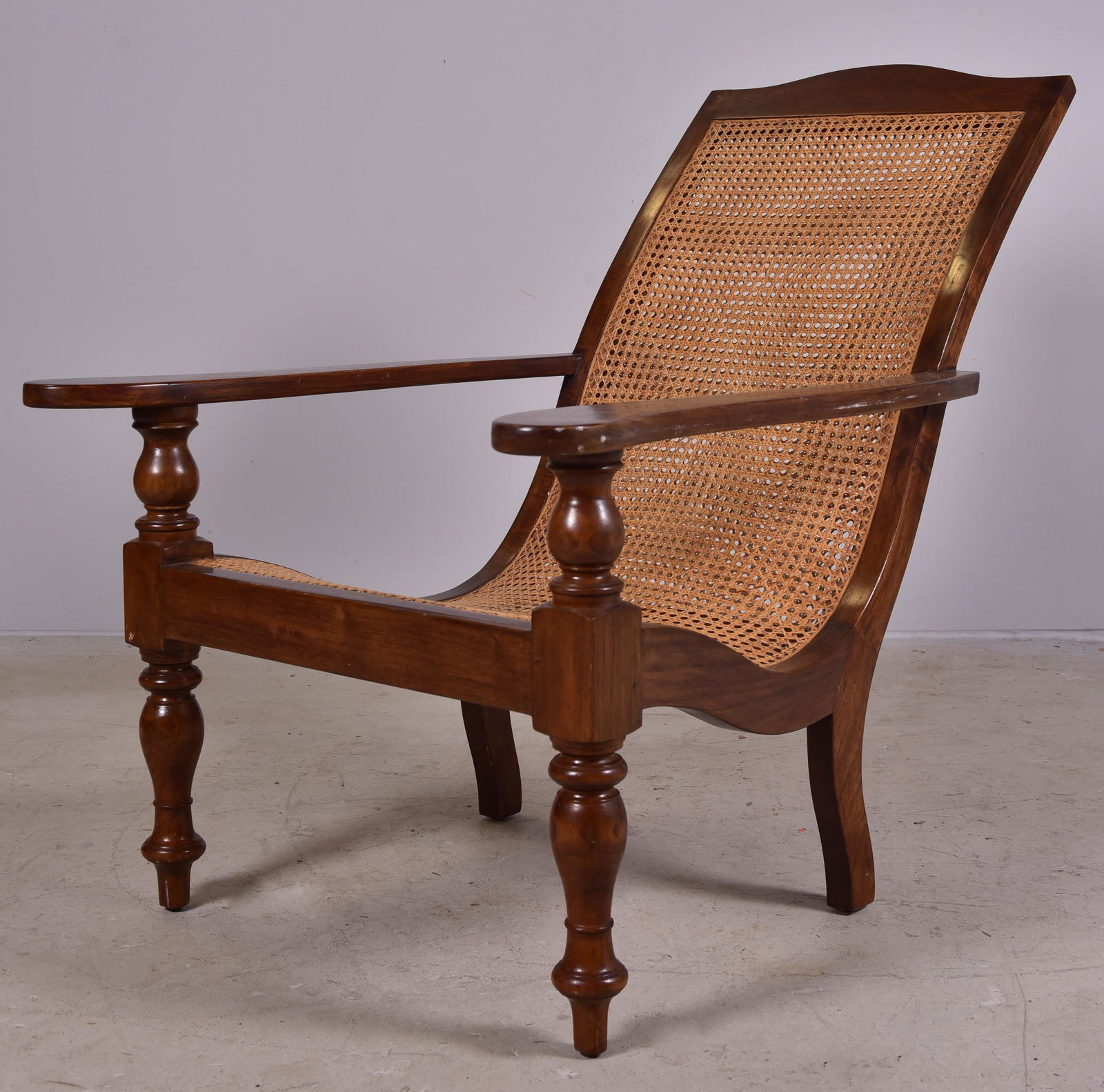 Mahogany Anglo Indian Plantation Chair: Mahogany Anglo Indian Plantation Chair, caned seat and back, 19th c, about 48" deep, 40" h, nice figured mahogany, the caning in excellent condition
