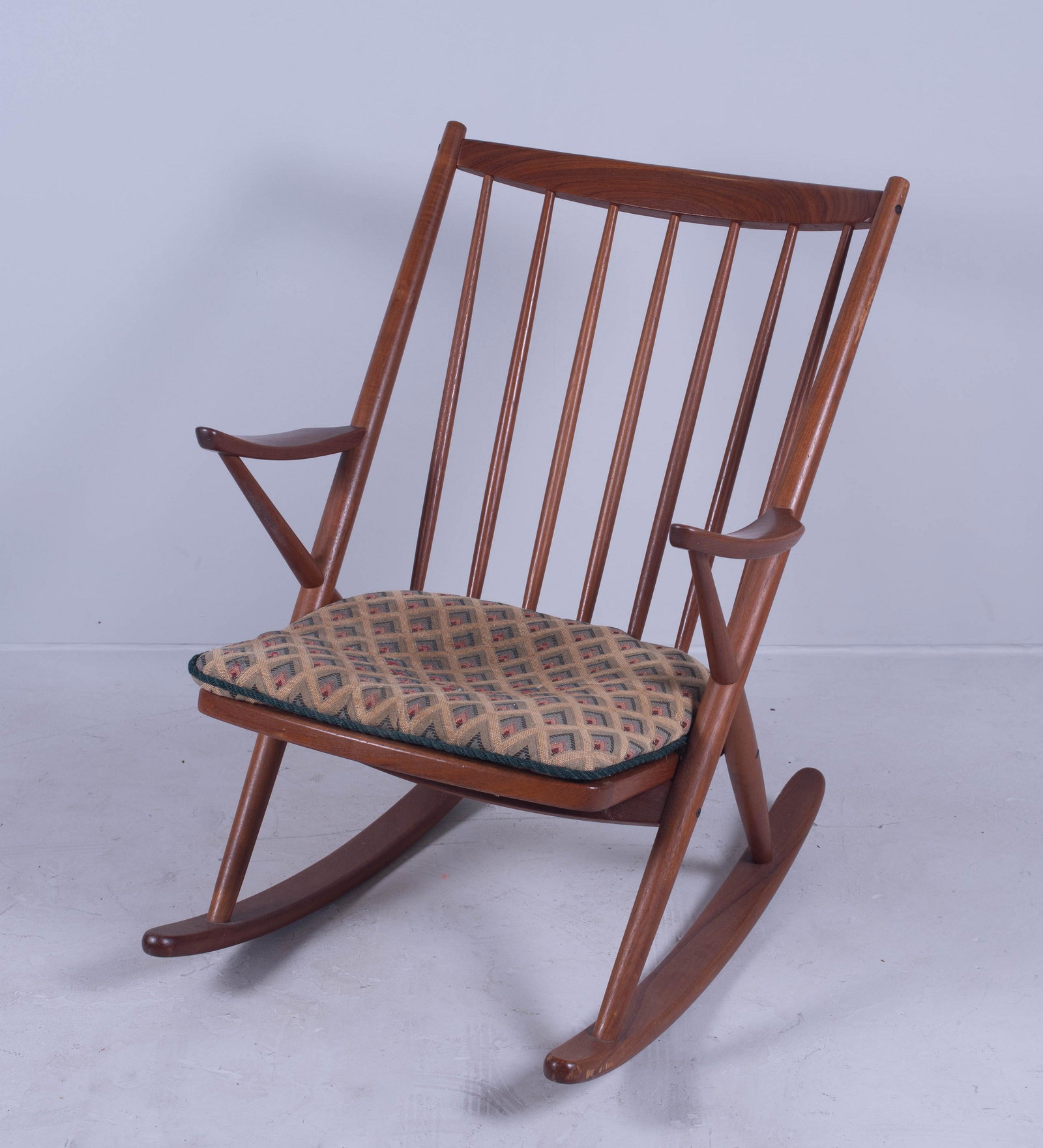 Bramin Danish Modern teak rocking chair: Bramin Danish Modern teak rocking chair, 34" h, seat height 16" h, cushion replaced has soiling, light wear