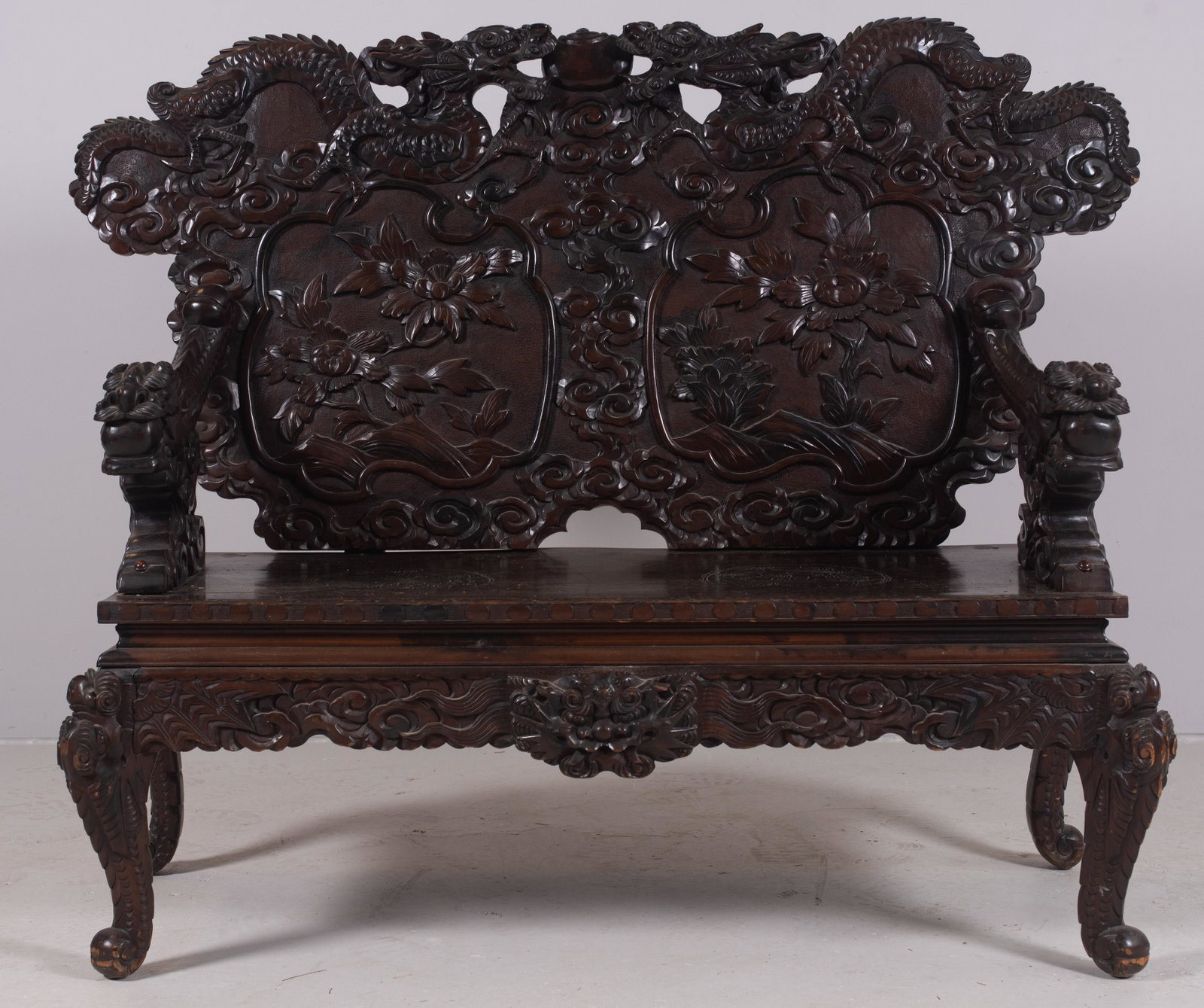 Dragon & Foliate Carved Japanese Settee: Dragon & Foliate Carved Japanese Settee, dragon arms and crest, double foliate paneled back, 46-1/2"h x 51"w x 22-1/2"d