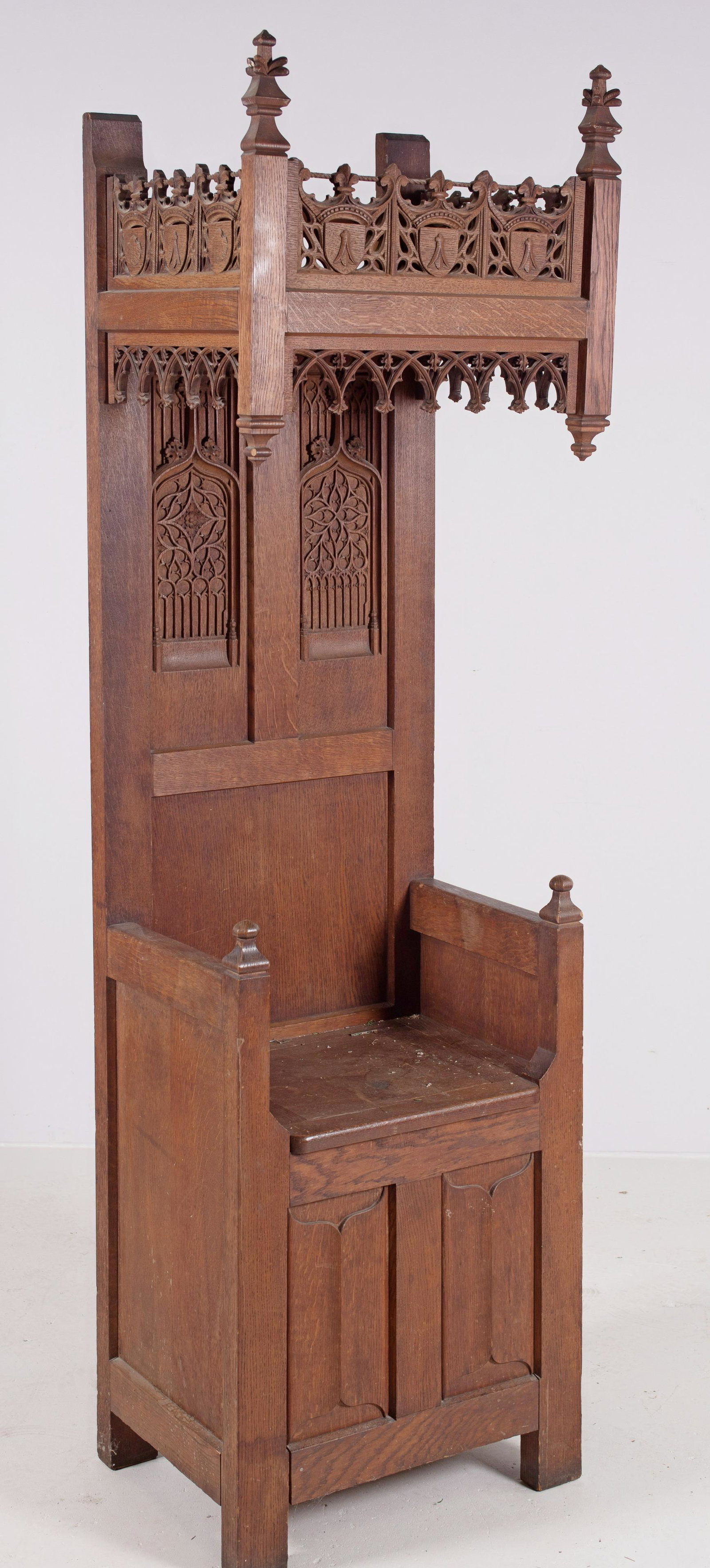 Carved Oak Hooded Gothic Hall Bench: Hooded Oak Gothic Hall Bench, carved crest and sides on hood, recessed carved panes in back, 85"h x 25"w x 18"d
