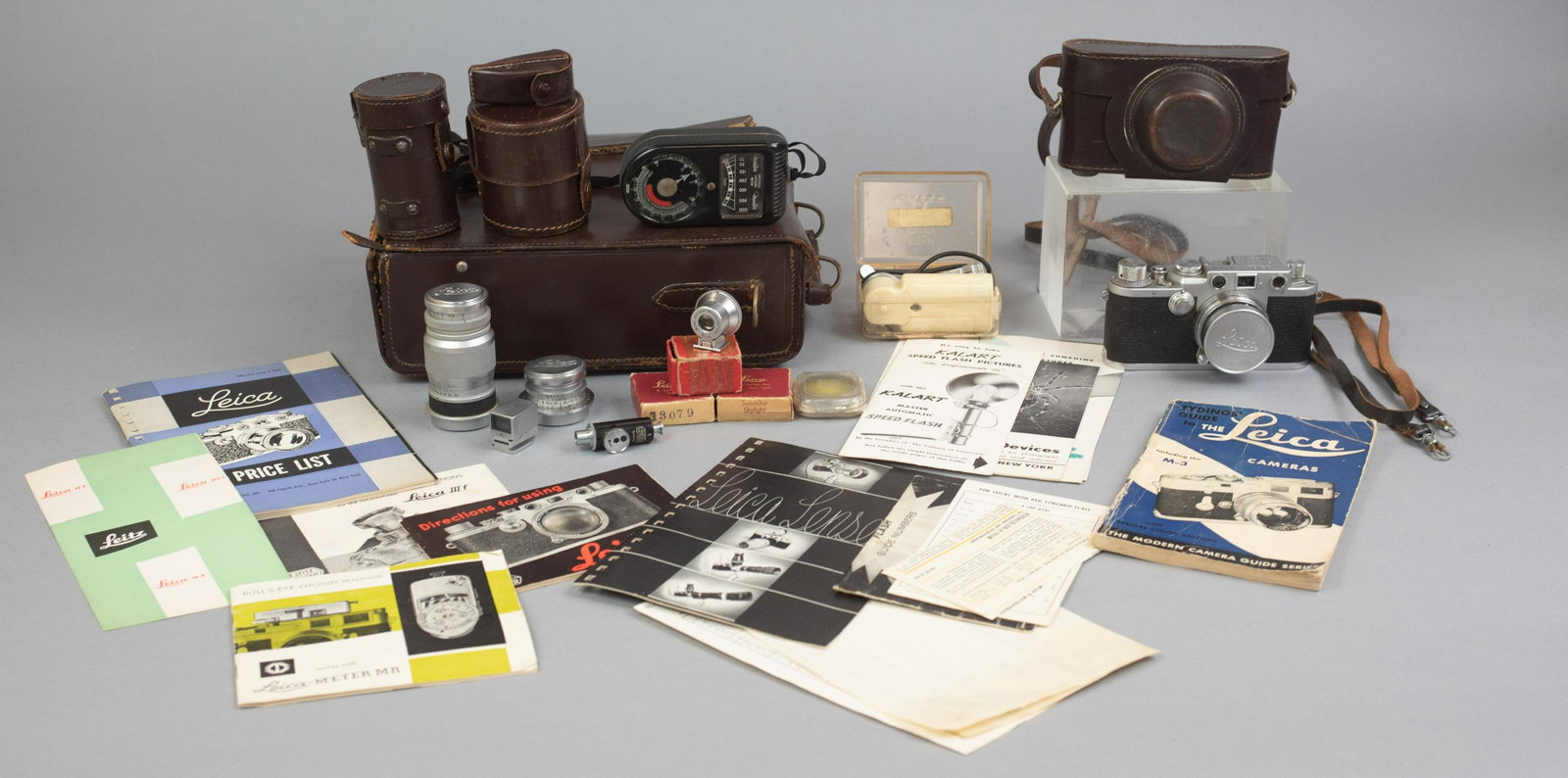 Leica IIIf 35mm Rangefinder with Lenses and Accessories: Leica IIIf 35mm rangefinder camera with, Summicron f=5cm 1:2, Elmar f=9cm 1:4 and viewfinder, Summaron f=3.5cm 1:3.5 and viewfinder. Included are various Weston Master light meter, Leitz "Chico" Flash