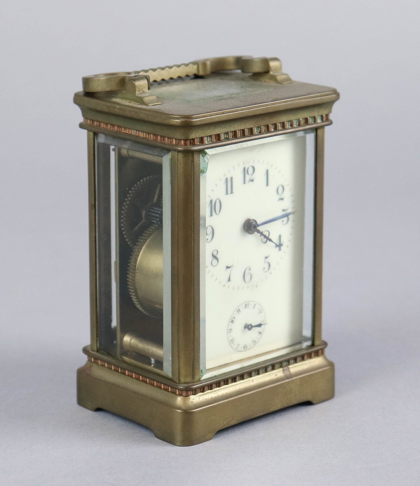 French Brass and Crystal Carriage Clock: French brass and crystal carriage clock, beveled glass (chip to corner of front glass), movement marked "Made in France", 4-1/2" h excluding handle, Runs reluctantly when wound, needs cleaning, alarm 
