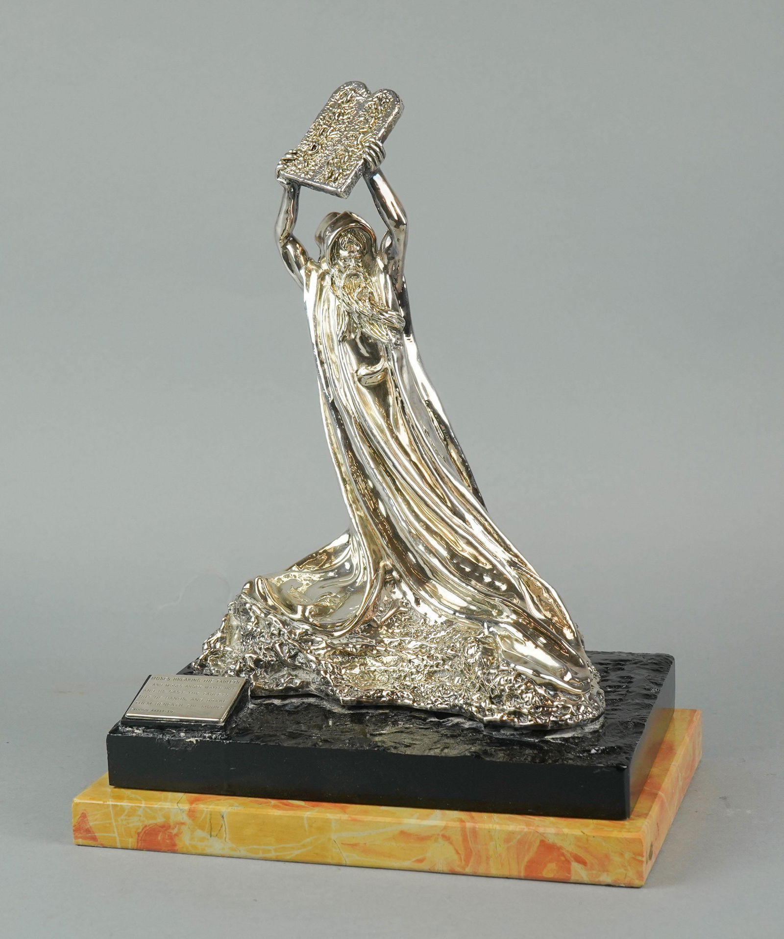 Sterling Clad 'Moses Breaking The Tablets': Sterling clad, 'Moses Breaking The Tablets' figure, after Ben Zion, c/o sterling clad Moses, tablets held over head, plaque reading 'Moses breaking the tablets...and Moses anger waxed hot, and he cast