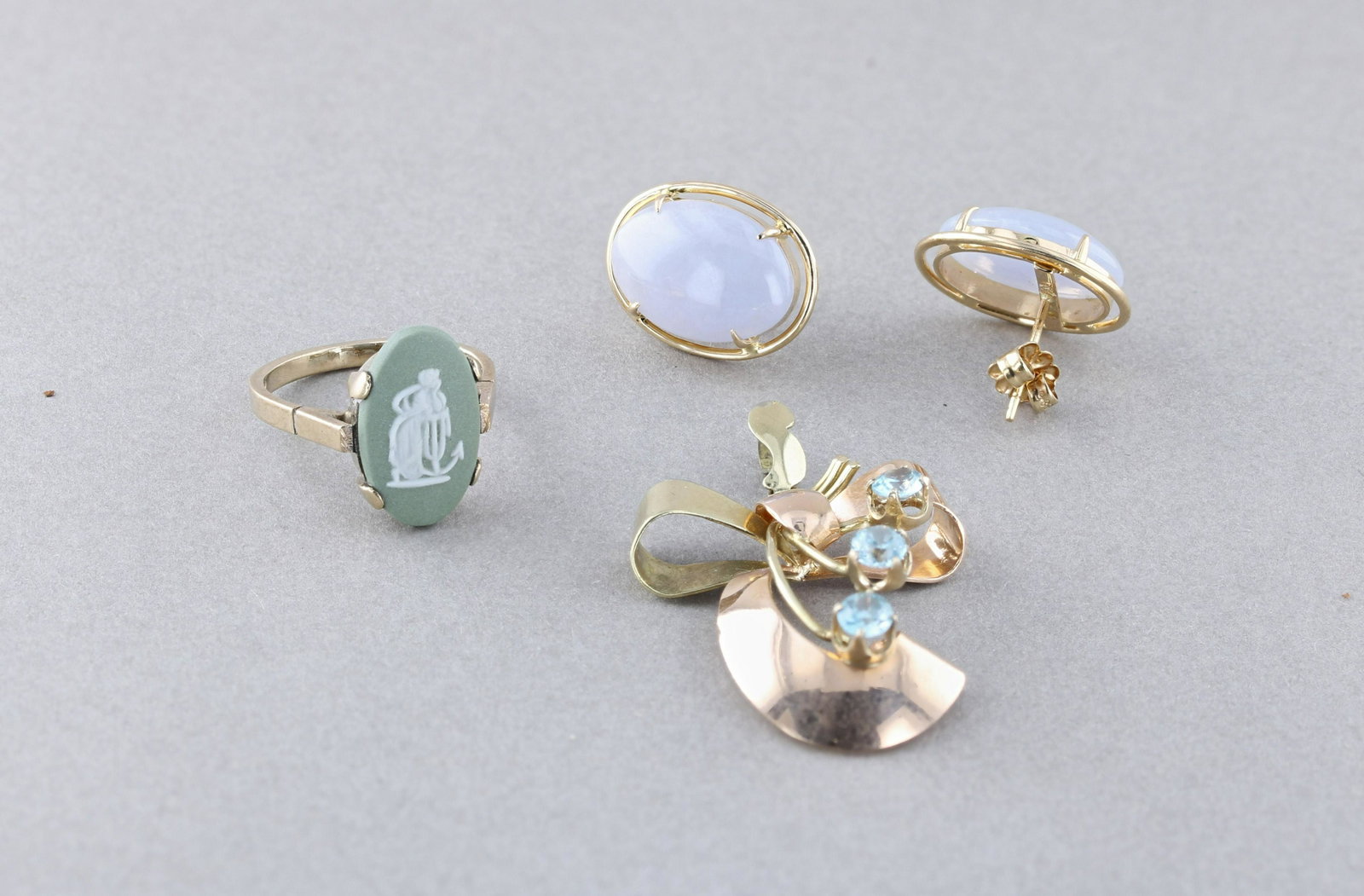 Jade Earrings, wedgewood ring, Esemco Pendant: (1) 14K Yellow gold 15.08mm purple oval Jade earrings, 3.3 dwt. (1) 8K ladies green wedgewood ring signed 375, 1.7 dwt Sz .6 (1) 10K Esemco Two tone gold pendant with 3 light blue stones 2.4 dwt, 1.5"
