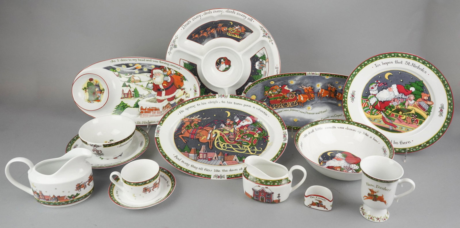 (90) Pcs Susan Winget Christmas Dinnerware: (33) Pcs International China porcelain dinnerware, A Christmas Story pattern, designed by Susan Wingert, c/o (11) 10-3/8" dinner plates, (15) 8-1/8" salad plates, (16) 8-1/2" soup bowls, (12) teacups,
