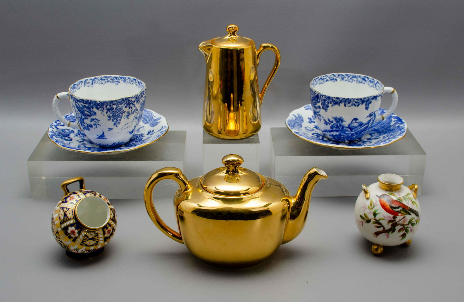 (8) Pcs Royal Worcester and Royal Crown Derby: (8) Pcs Royal Worcester and Royal Crown Derby to include Royal Worcester gold lustre coffee pot, 6" h, Royal Worcester gold lustre teapot, 5" h, Royal Worcester footed pot in parcel gilt and bird deco