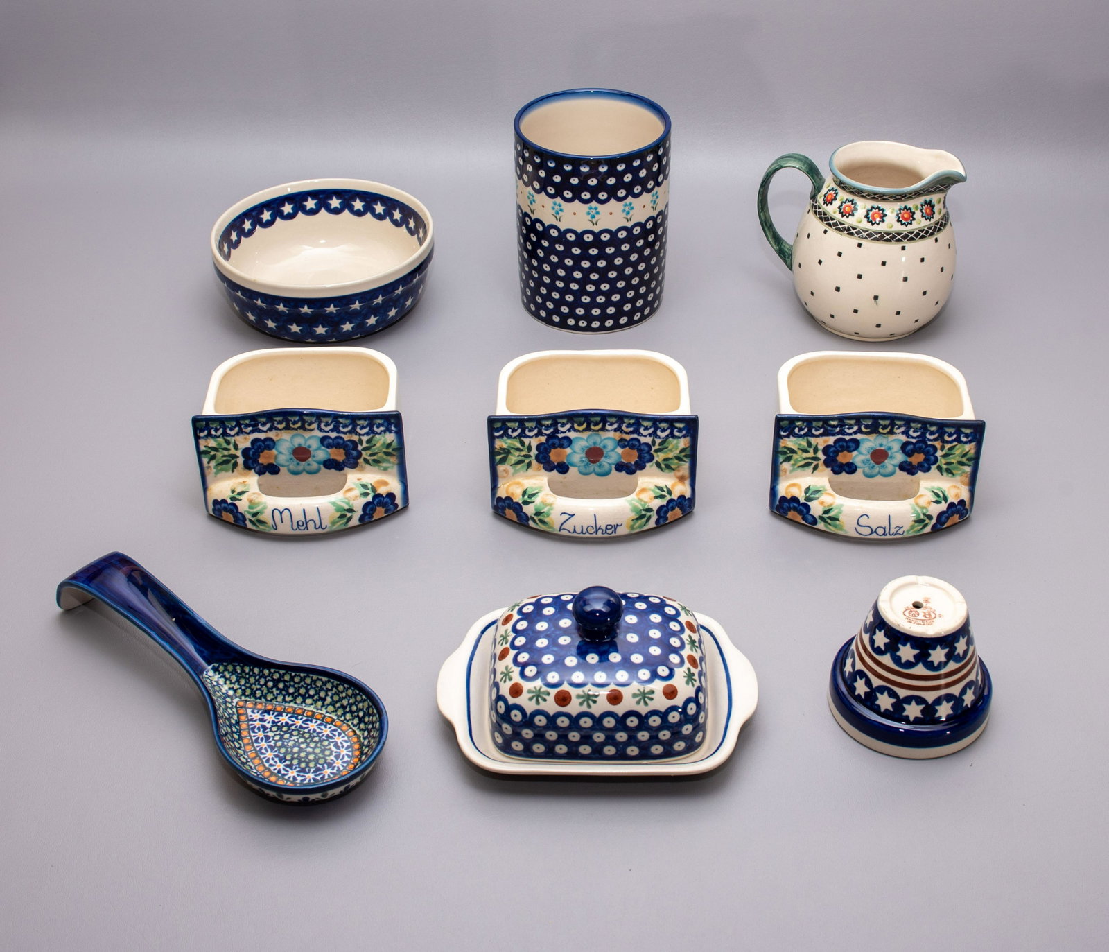 (9) Pcs Boleslawiec Pottery: (9) Pcs Boleslawiec pottery, Poland, c/o utensil jar, (3) drawers marked "salz, zucker, mehl", round serving bowl, pitcher, covered butter or cheese dish, spoon rest, planter
