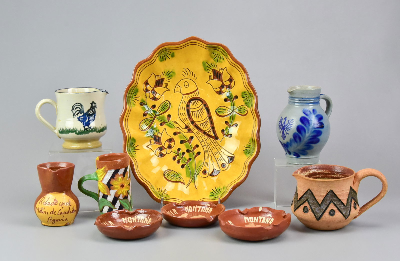 (9) Pcs Pottery: (9) Pcs pottery, including Robesonia Redware bird & flowers bowl inscribed on back "Robesonia Redware Robesonia PA June 25 2014 sun & clouds", Nicholas Mosse Pottery spongeware rooster creamer, blue d