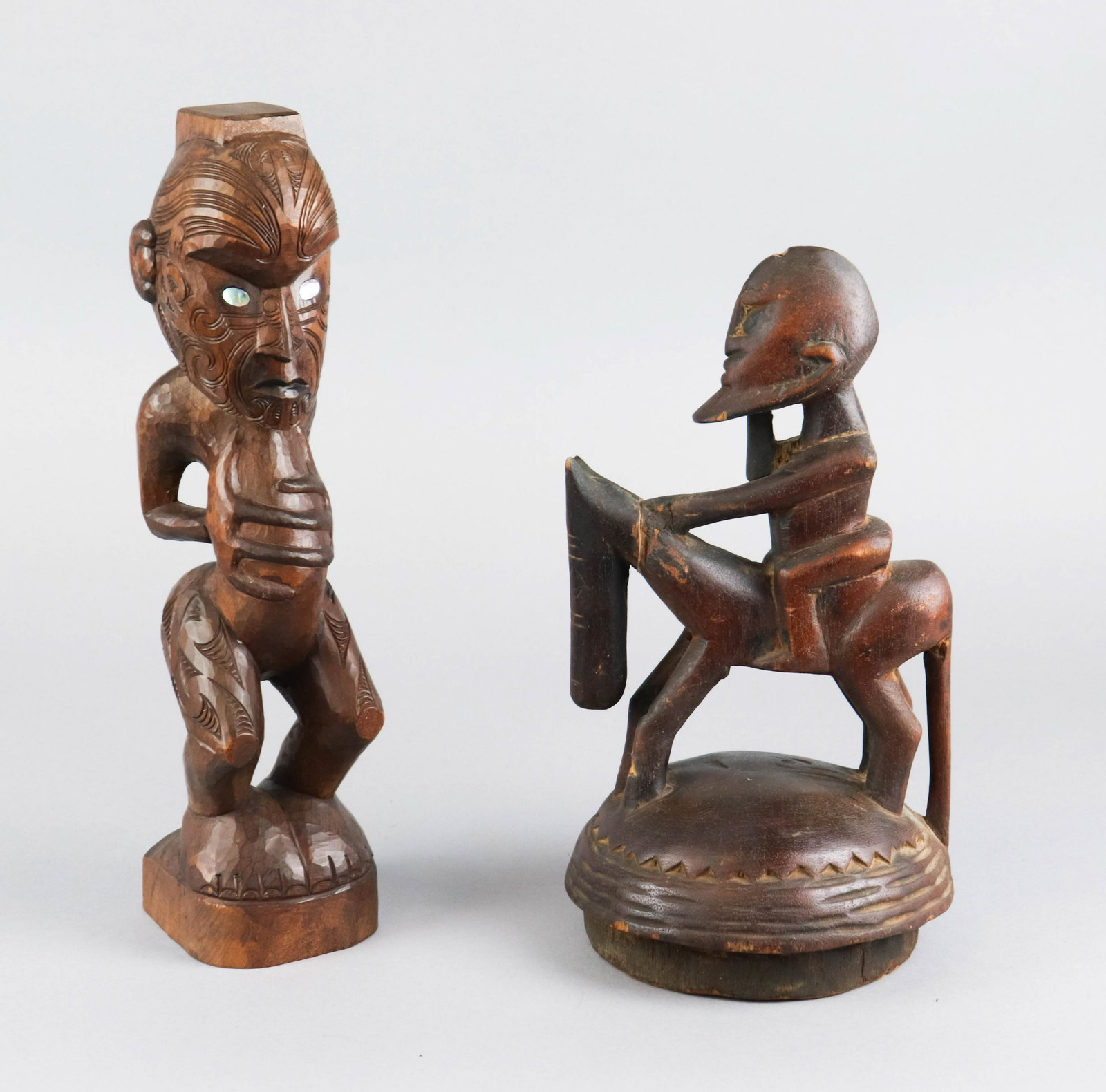 (2) African Carved Wood Statues: (2) African carved wood statues, c/o Maori teko teko figure man with mother of pearl eyes, bearded man on horse (repaired head on horse, tallest 15"