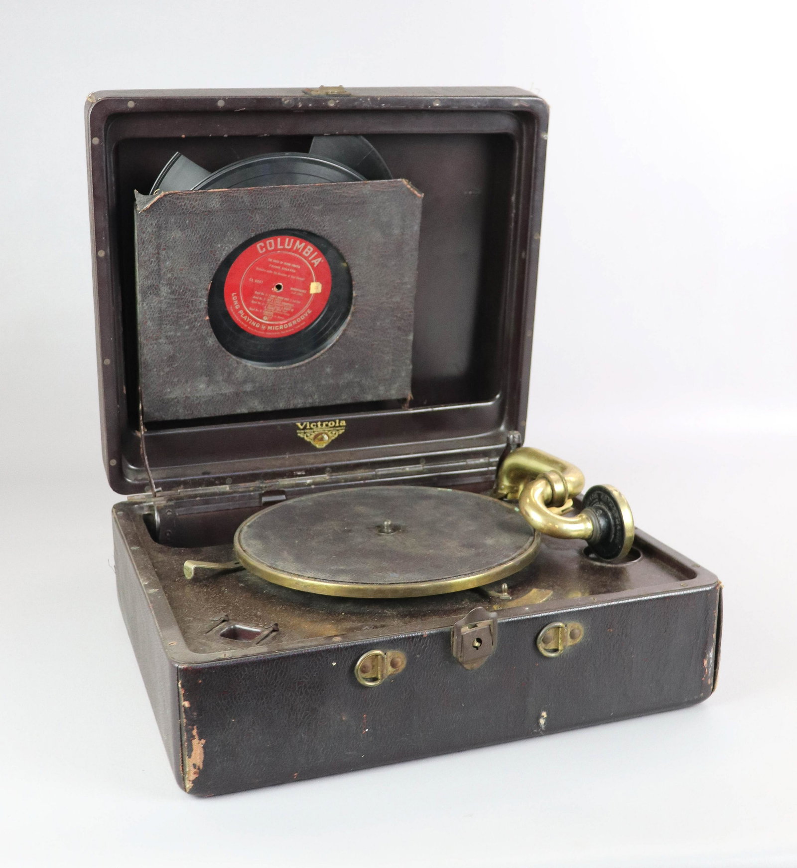 Table Top Victrola w/ records: Table Top Victrola w/ records, leather case, handle broken but inside, 7-1/2" h x 16" w