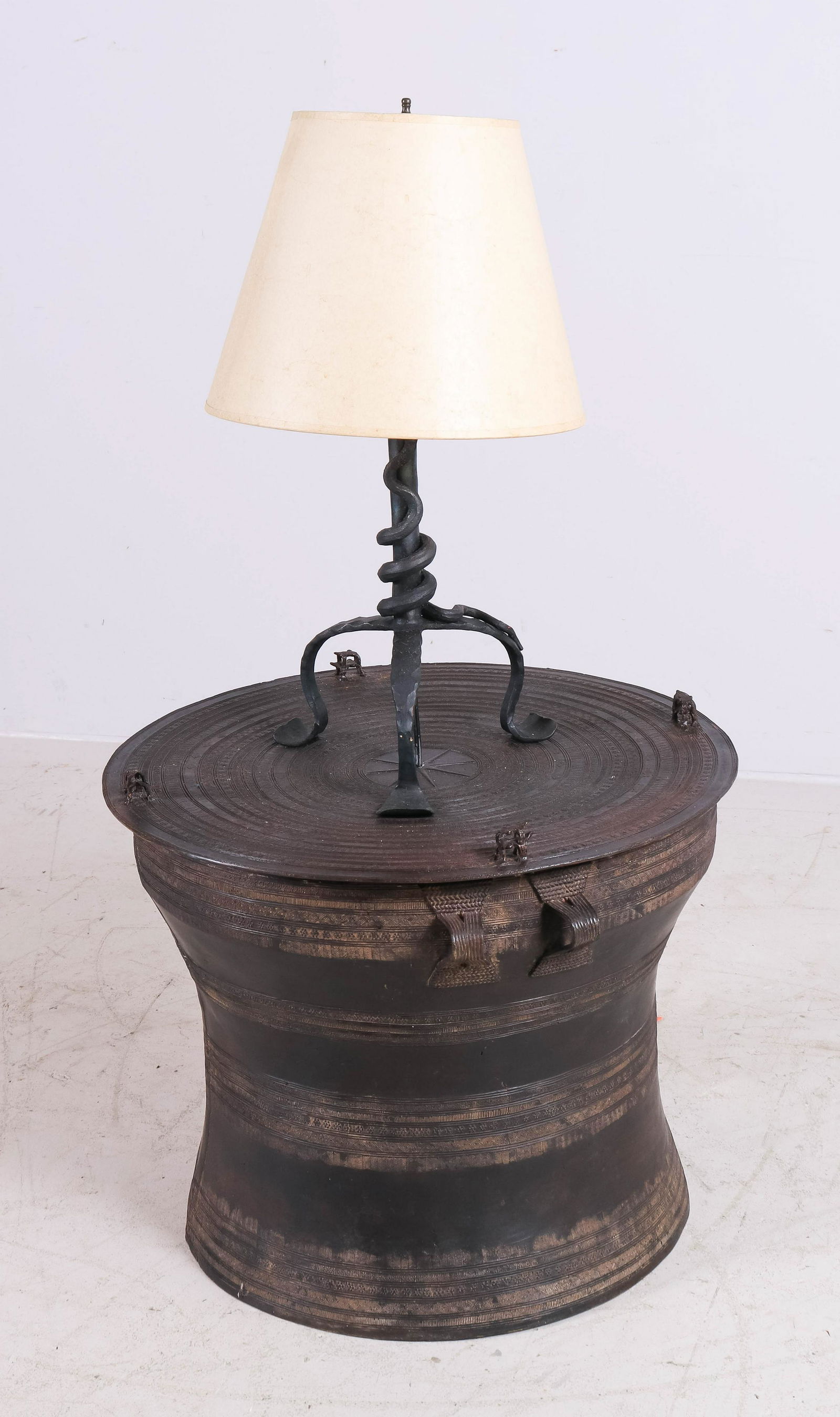Tribal metal decorative lamp table: Tribal metal decorative lamp table with attached wrought iron lamp, 46" h x 26" diameter