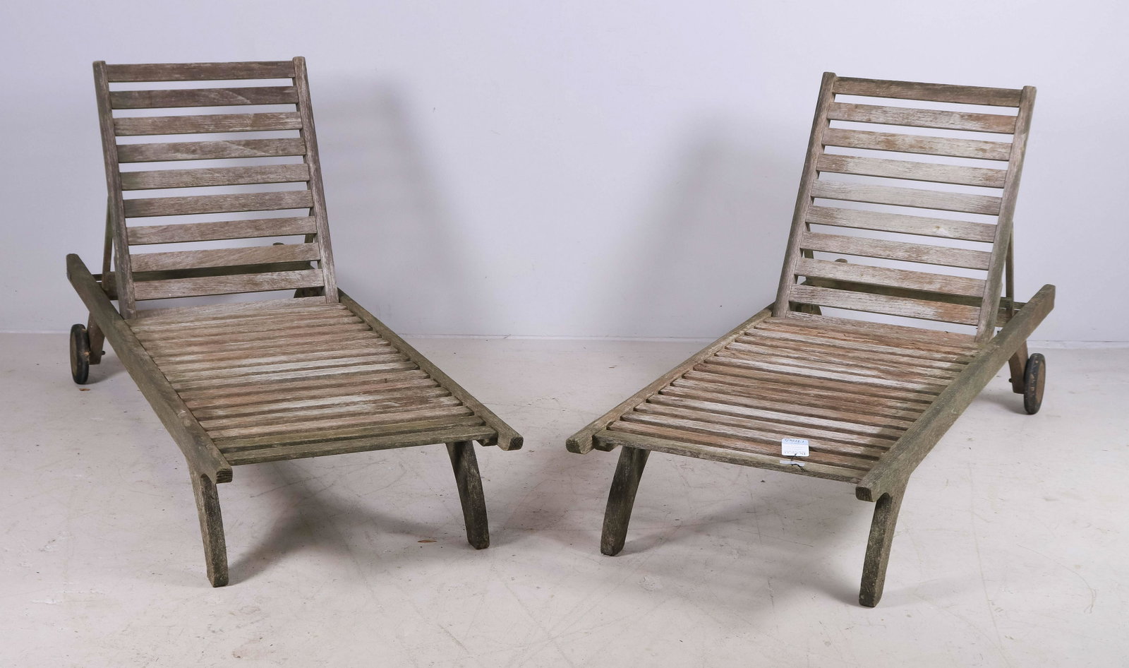 Pair Barlow Tyrie teak lounge chairs: Pair Barlow Tyrie teak lounge chairs, adjustable seat back, 12" h x 77-1/2" w, wear and moss