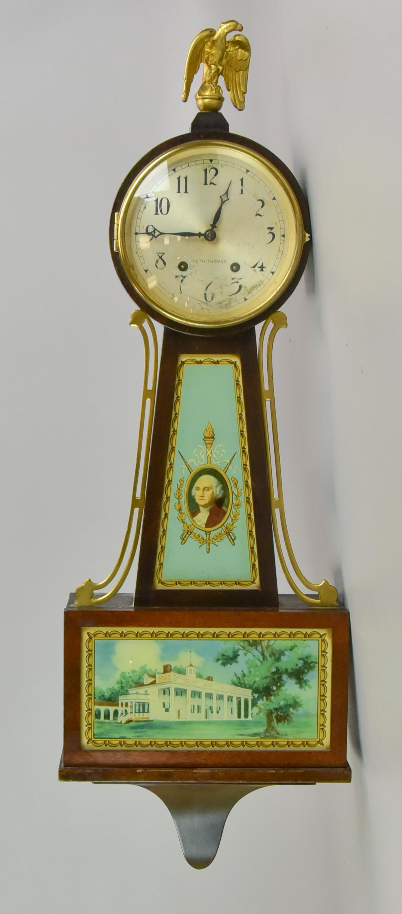 Seth Thomas Banjo Clock: Seth Thomas banjo clock, glass with portrait prints of George Washington & Mount Vernon, American Eagle finial, with pendulum & key, 29" h