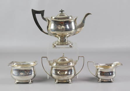 (4) Pc Watson & Newell Co. Tea Set: (4) Pc Watson & Newell Co. tea set to include tea pot, 2-1/2" pints, creamer, covered sugar and waste bin, all raised on bun feet with monogram etched at front, 52.6 TO, weight includes wood handle an