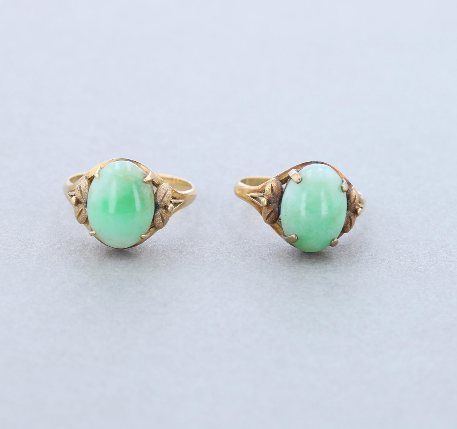 (2) 18K Yellow Gold Green Stone rings: (2) Matching 18K Yellow gold rings, one has a broken shank, one sz. 7.25; Total weight: 4.2 Dwt.