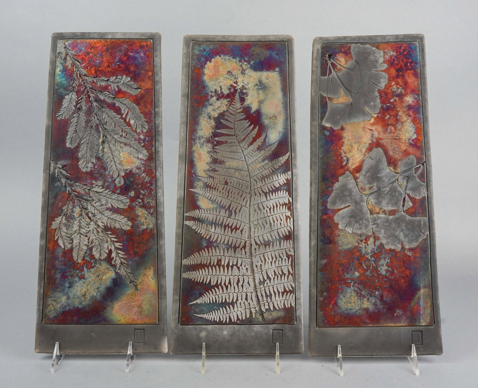 (3) Giusti Raku Plaques: (3) Giusti raku plaques in ginko, fern and redwood, 16" H x 6-3/4" W