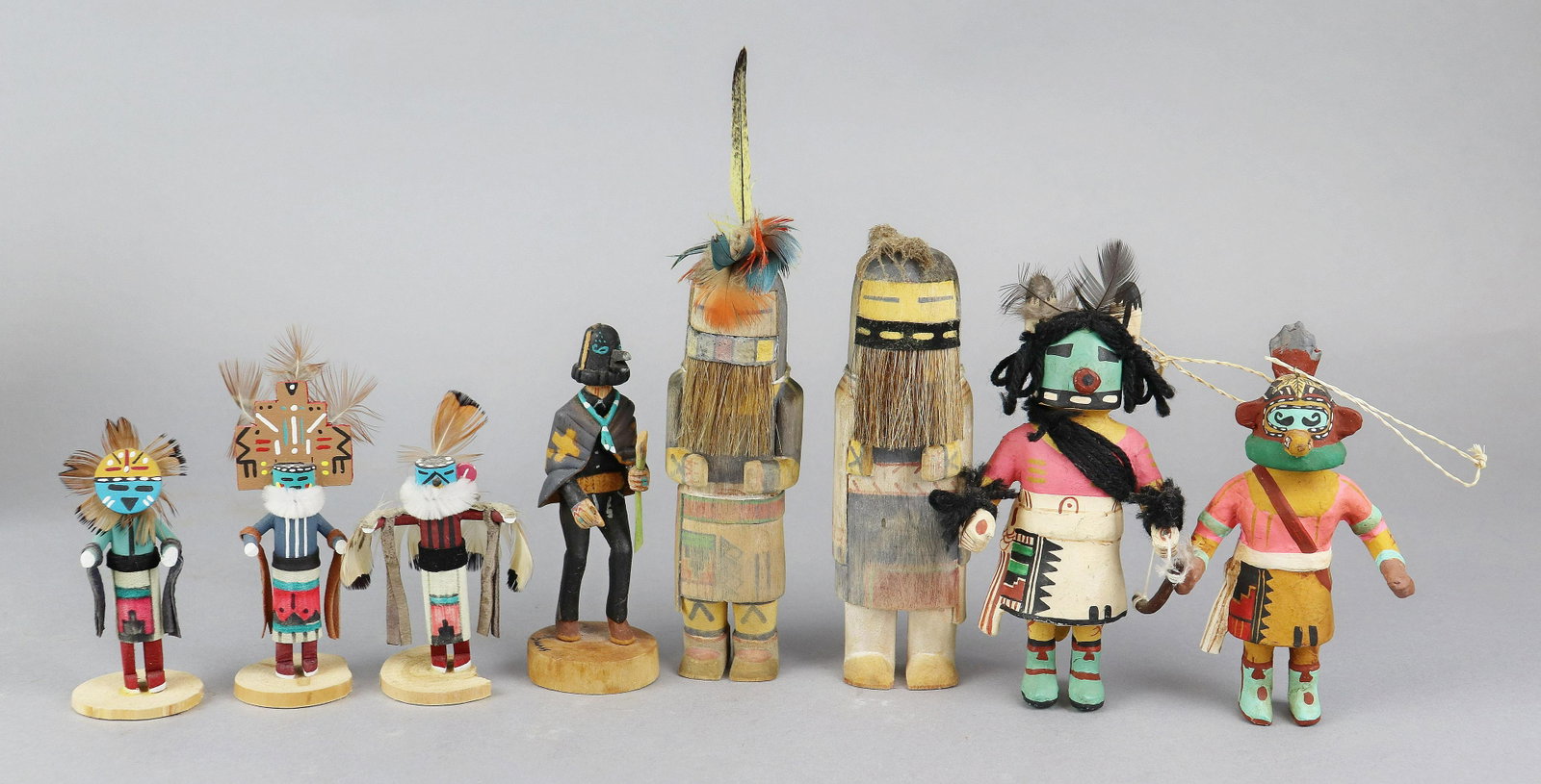 (8) Hopi Kachina Dolls: (8) Hopi Kachina dolls to include Sun Face, 4" h, signed R9, Hemis, 4-1/2' H, signed R9, 3-1/2" doll, on cracked base, Dallas signed crow headed figure in cloak, 5" H, cracks and missing implements, p
