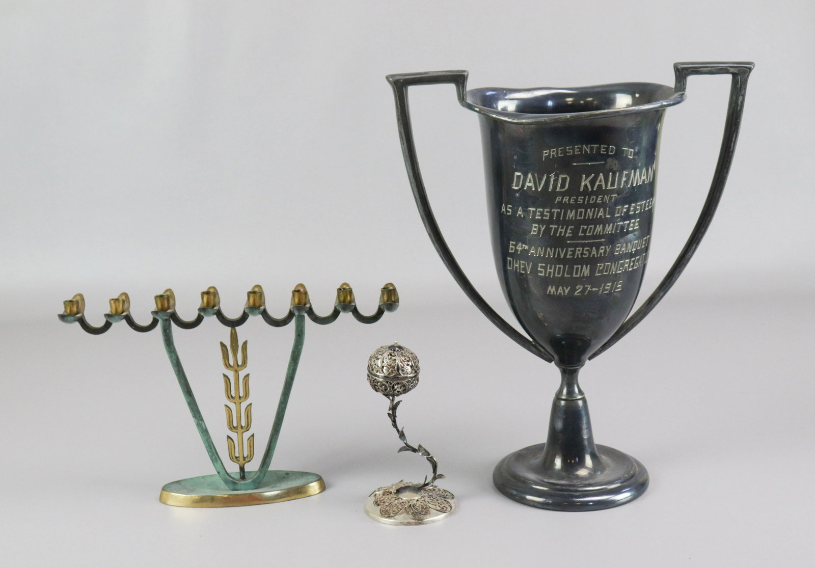 Trophy Cup, Spice Flower and Menorah: Trophy cup, spice box and menorah c/o silver plate presentation trophy engraved, "Presented to David Kaufman president as a testimonial of esteem by the committee 64th anniversary banquet Ohev Sholom 