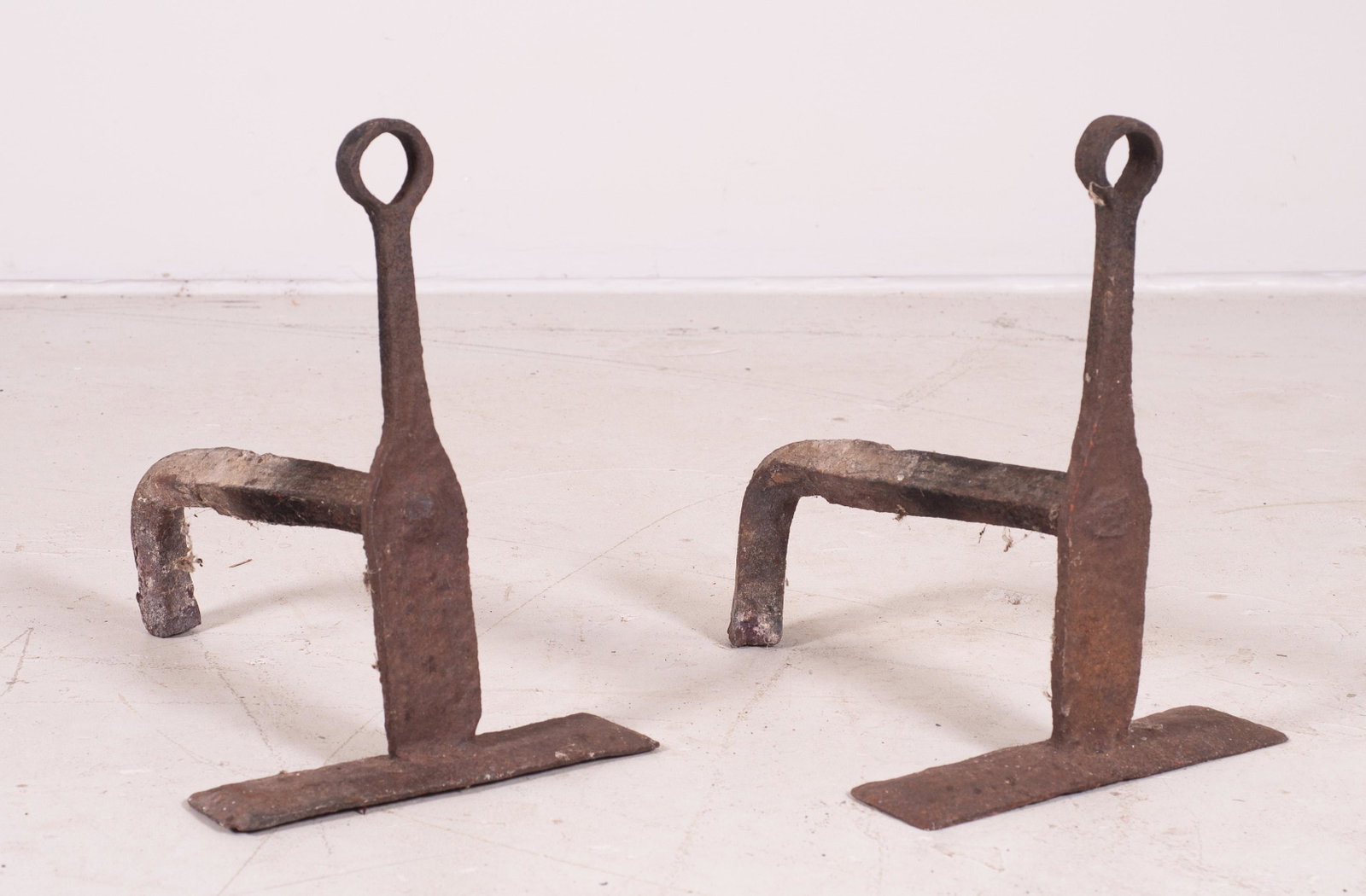 Primitive Iron Andirons: Primitive iron andirons, hand forged with loop top and flattened foot, 13-1/4" h