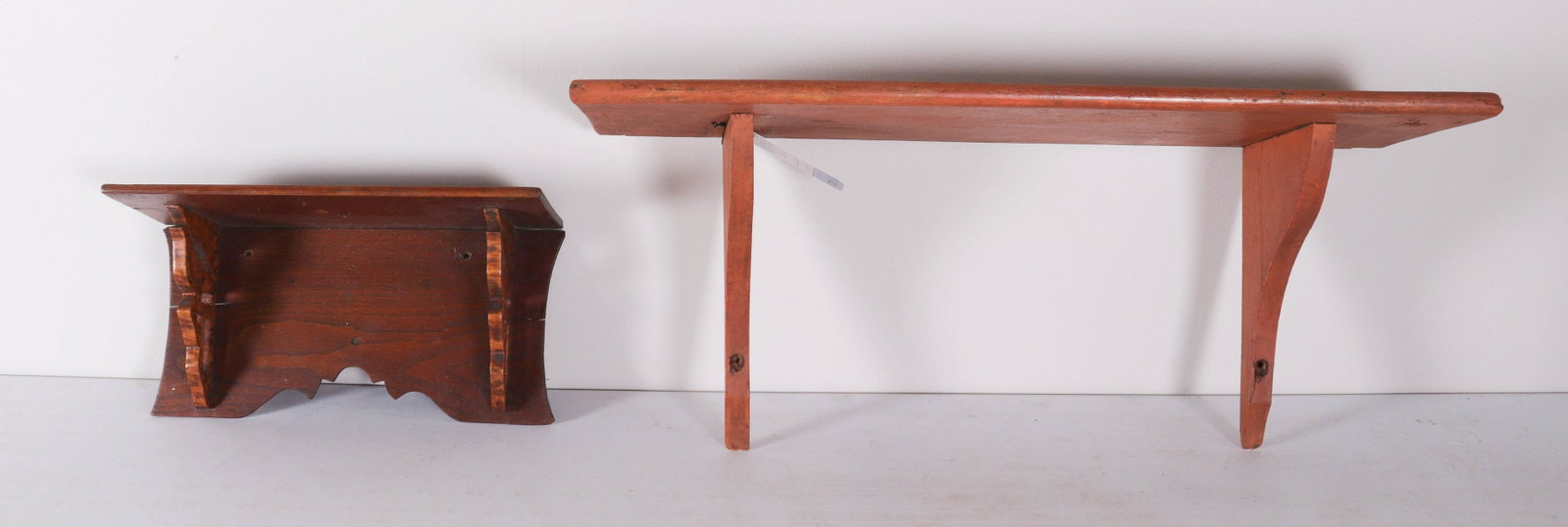 (2) Wooden Wall Shelves: (2) Wooden wall shelves to include birds eye maple bracket raised shelf, 16-1/4" L x 6-1/2" D and orange painted wall shelf, 31-1/4" L x 10" D