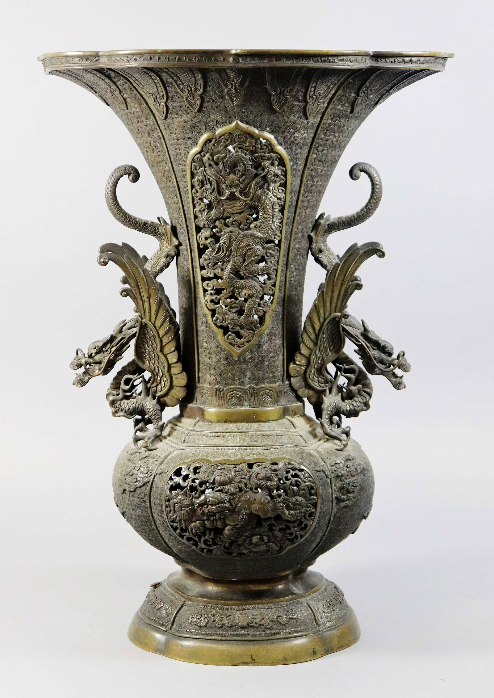 Chinese Bronze Vase: Chinese bronze vase, pierced panels, dragon handles, pierced body, impressed 9-character mark to base, 15" x 11-1/4" x 21-1/4" h