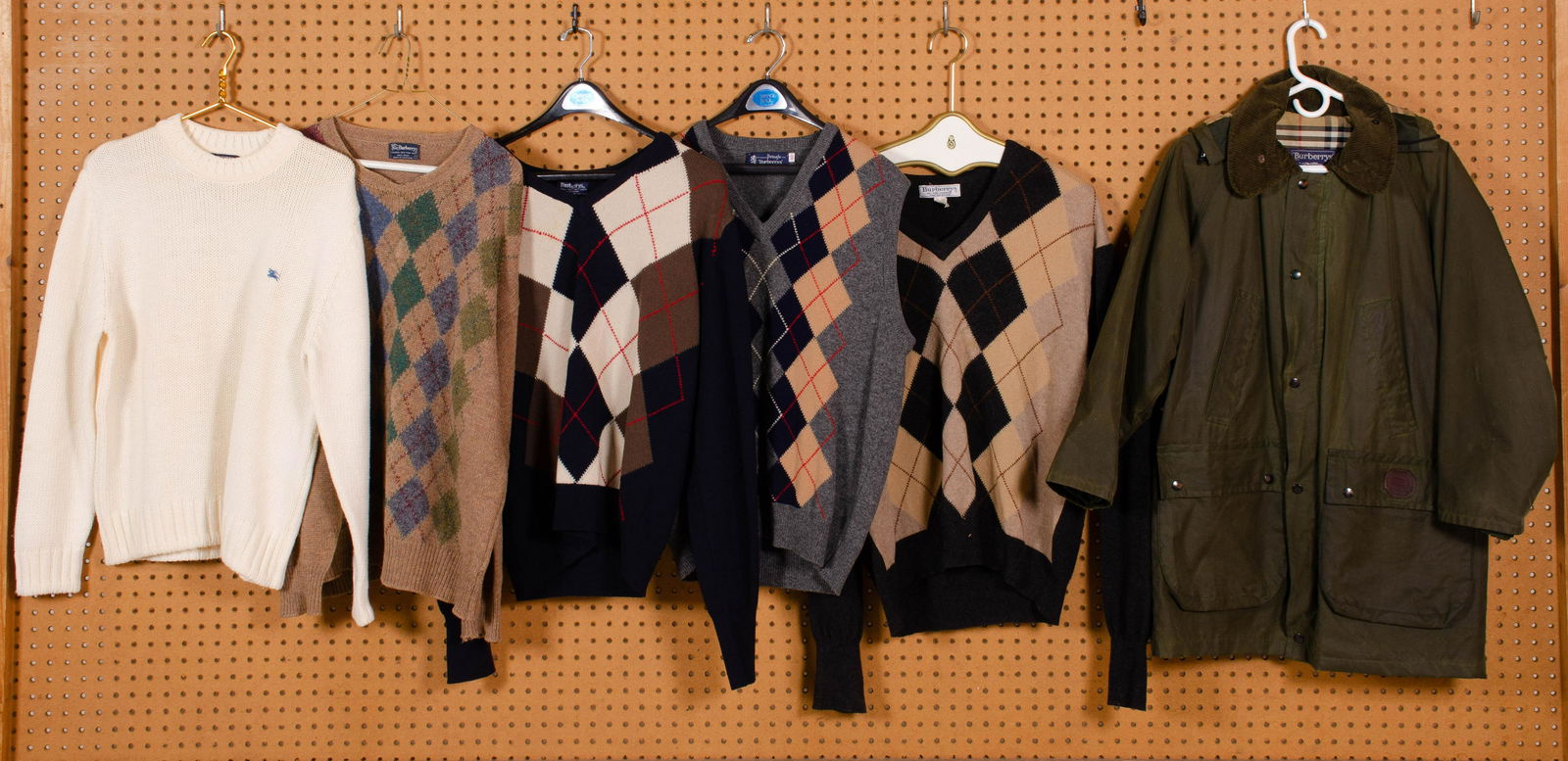 (6) Pcs Burberry Coat and Sweaters: Burberry coat and sweaters to include Burberrys cupra cotton/waxed cotton coat with cord collar, plaid lining and removable plaid lined hood, 48" underarm to underarm, 31" shoulder to hem, some wear t