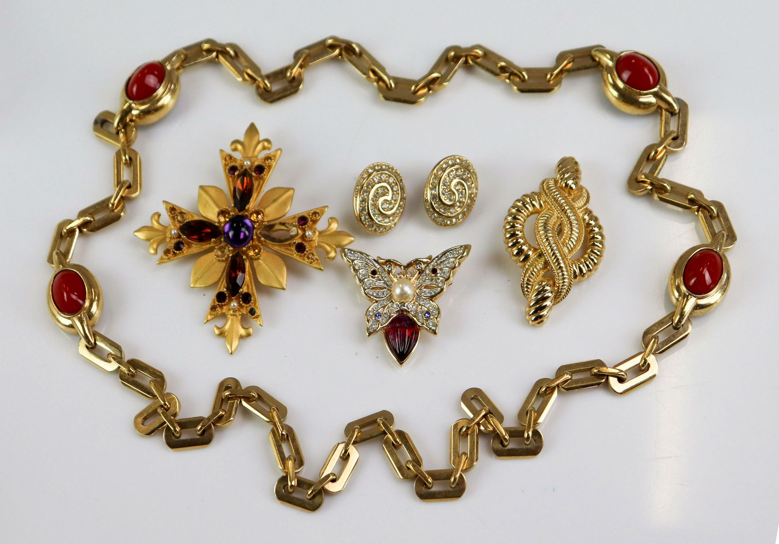 Christian Dior and Other Jewelry: CHRISTIAN DIOR and other Jewelry Lot C/O; (1) Twist design pin, signed Chr. Dior; (1) Signed Chr. Dior Rhinestone Swirl clip earrings; just under 1" (1) Signed CINER Oval Link Necklace 32" long. (1) u