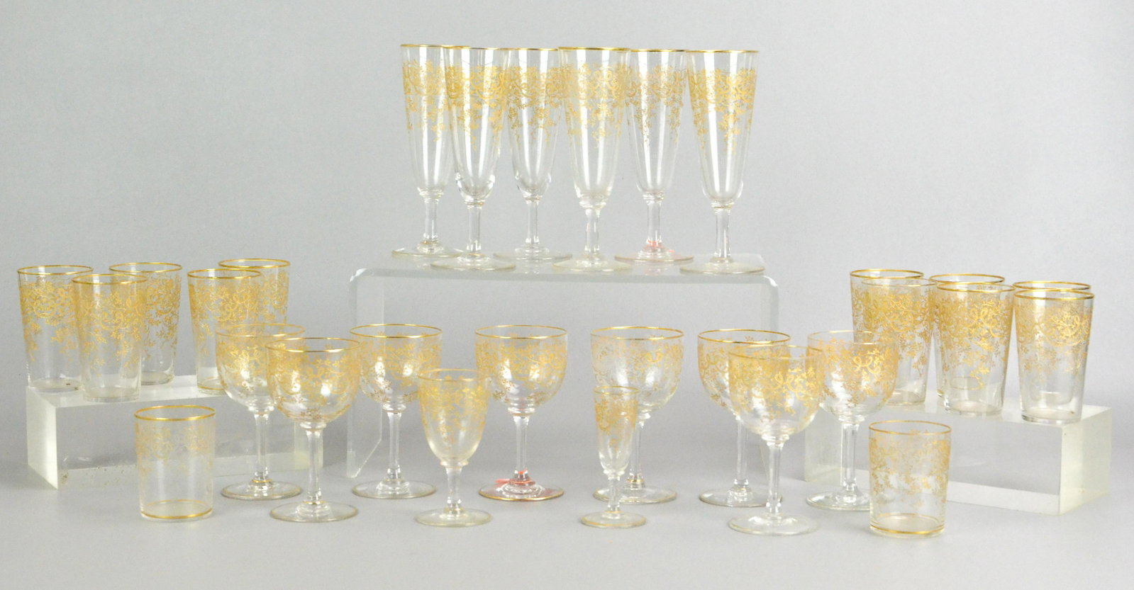 (29) Gold Trimmed Glassware: (29) Gold trimmed glassware, c/o (6) 6-1/2" champagne flutes, (8) 4-1/2" wine glasses, (1) 3-7/8" port wine glass, (1) 3-1/2" cordial, (11) 3-1/2" juice glasses, (2) 3" tumblers
