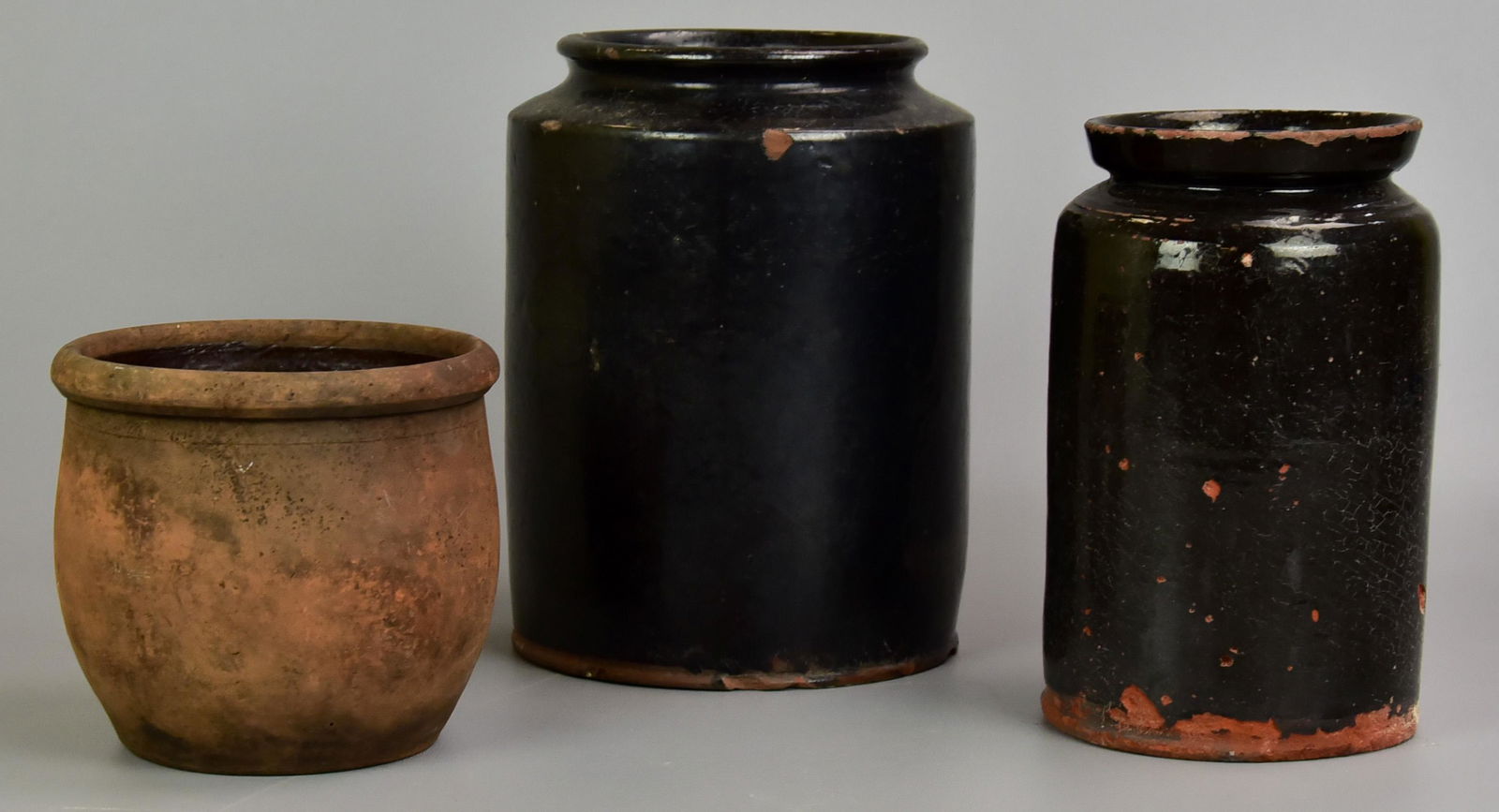 (3) Redware Vessels: (3) Redware vessels to include (2) glazed redware vessels, 8-1/2" H and 9-1/2" H and unglazed redware vessel, possible planter, 5-3/4" H