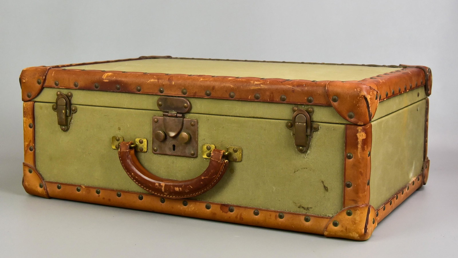 Polo Ralph Lauren Leather and Canvas Clad Case: Polo Ralph Lauren leather and canvas clad case, made in Italy, riveted leather trim with reinforced corners, antiqued brass hardware with double latch closure and leather wrapped handle. Interior line