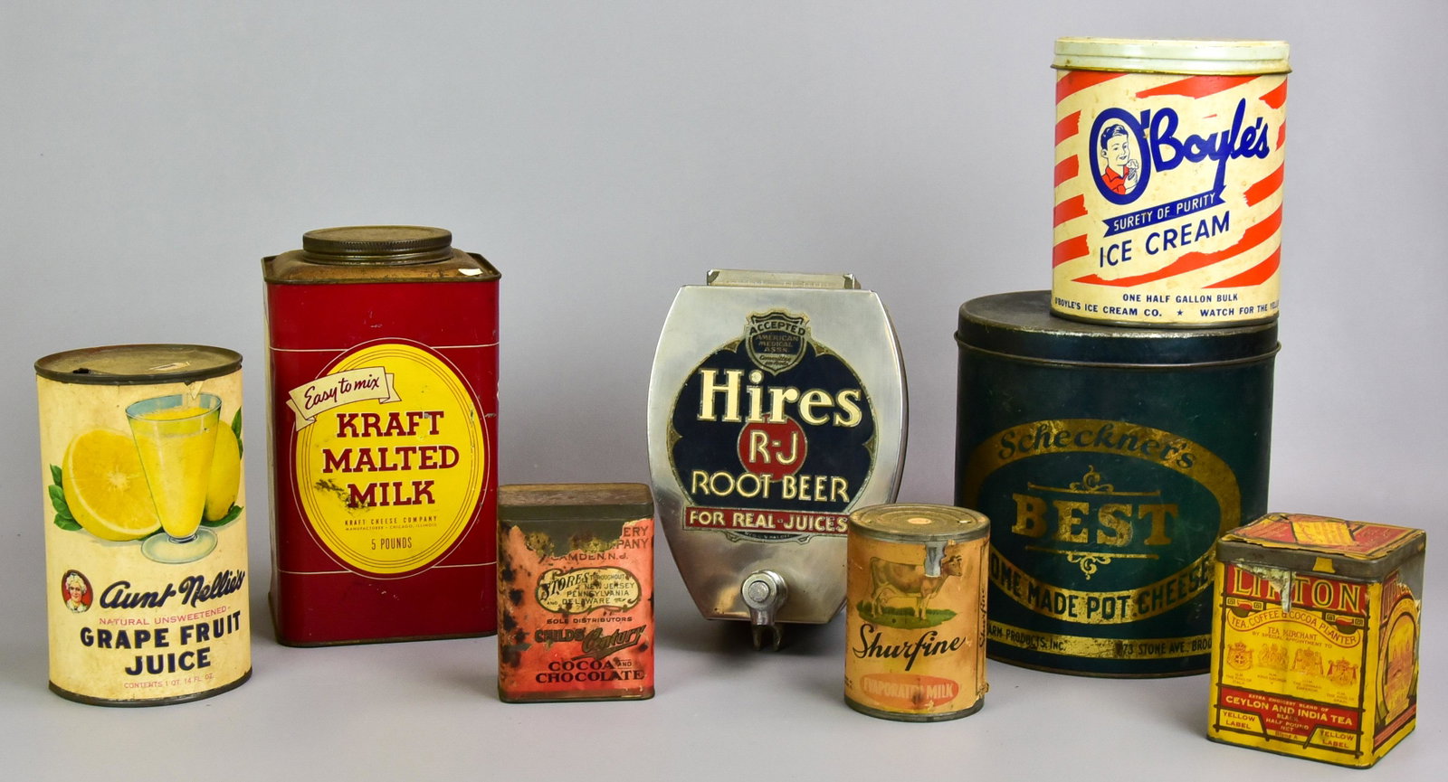 (8) Litho Printed and Advertising Tins: (8) Litho printed and advertising tins to include Hires R-J Root Beer syrup dispenser, missing lid and base, Kraft Malted Milk tin, O'Boyles ice cream, Scheckner's Best Pot Cheese tin, Aunt Nellie's G