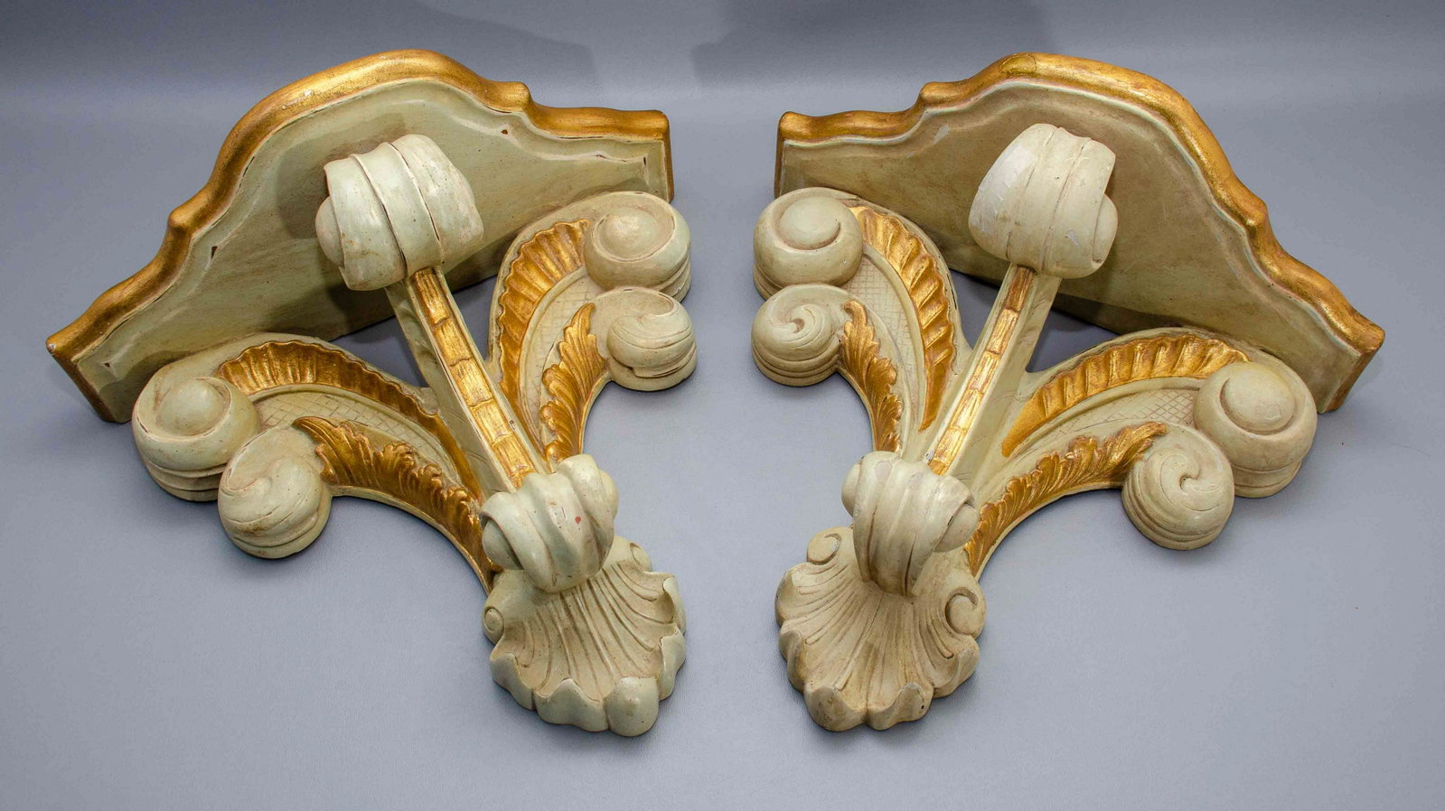 Pair Rococo Style Wall Shelves: Pair Rococo style wall shelves, wood and composite comprised in shell and scroll form with chalky sage and brushed gilt paint, some areas of inpainting, 15-1/2" h, 16-1/2" L, 9" deep