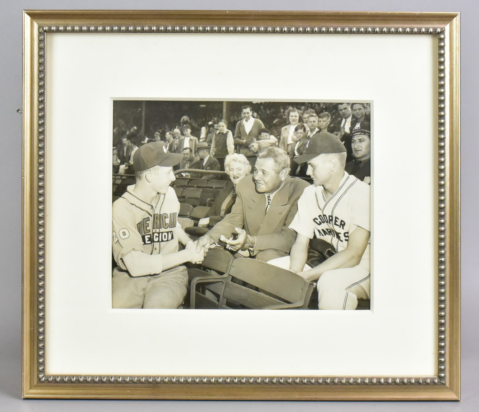 Babe Ruth Visitation of American Legion Baseball, 1947: Babe Ruth visitation of American Legion baseball game, 16"x14" framed, 9" x 7" photo, while on promotional tour between '46 and '47, possible first iteration of said photo, Babe Ruth visited many stad