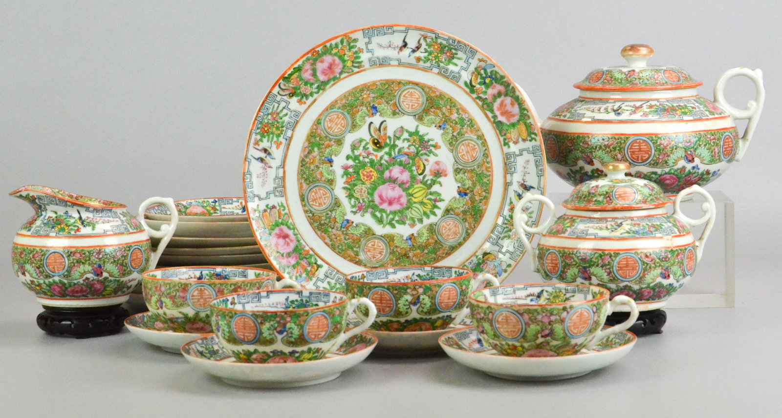 (21) Pc Chinese Famille Rose Tea Set: (21) Pc Chinese Famille Rose tea set, all marked "China", c/o teapot, creamer, sugar, (2) 9-3/8" plates, (6) 7-3/4 plates, (4) teacups, (6) saucers, Flea bites, some all over gilt loss and paint loss