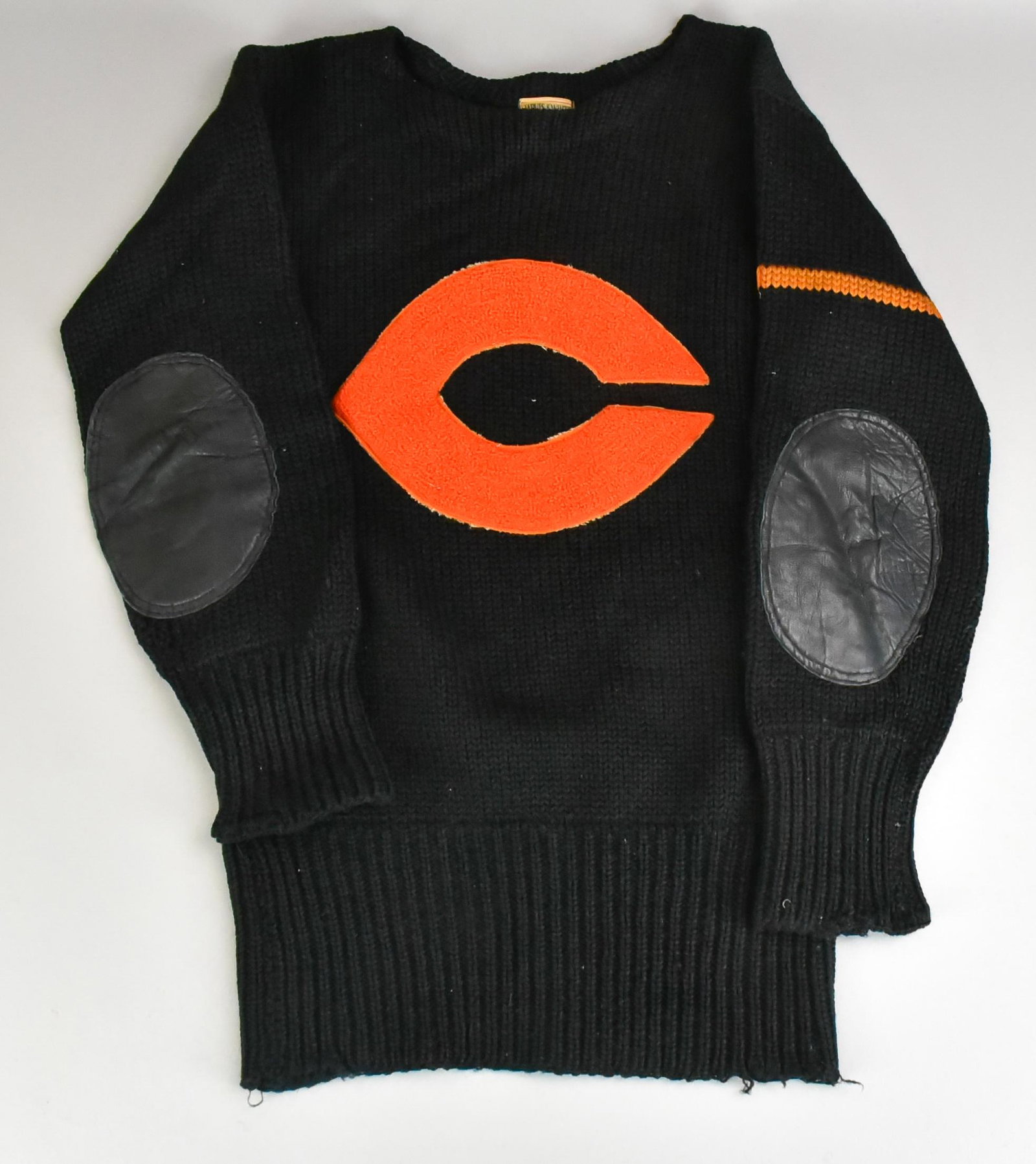 Jarvis & White 1940's Chicago Bears Sweater: Jarvis & White 1940's Chicago Bears sweater, tag reading, 'Jarvis & White Athletic Goods, 23 E. Jackson Blvd. Chicag, large C at front with orange stripe at upper arm, 35" bust, leather elbow patches.