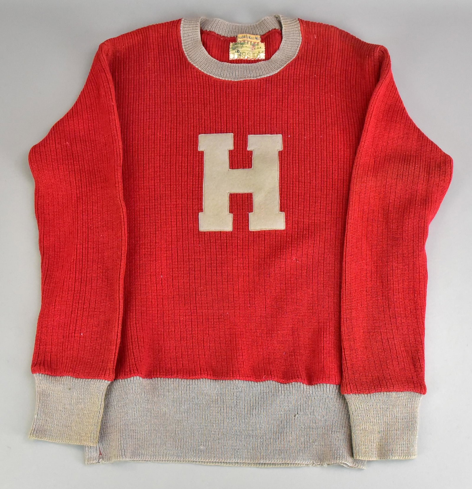 30's/40's Harvard Knit Sweater, Warner Bros.: 30's/40's Harvard Knit sweater, Warner Bros., Broadway Knit Mill Los Angeles tag with 'Warner Bros.' tag sewn in, dated 4-3-44, prod. 621 size 40 reads 'Doubles 1B9346' in maroon and grey knit with gr