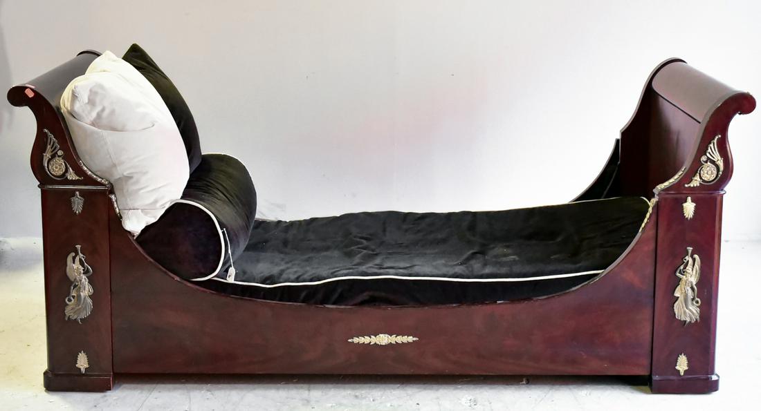 Empire mahogany gilt bronze daybed: Empire mahogany gilt bronze daybed, black velvet upholstery with white piping, gilt bronze mounts, 40-1/4"h x 75-1/4"w x 35"d