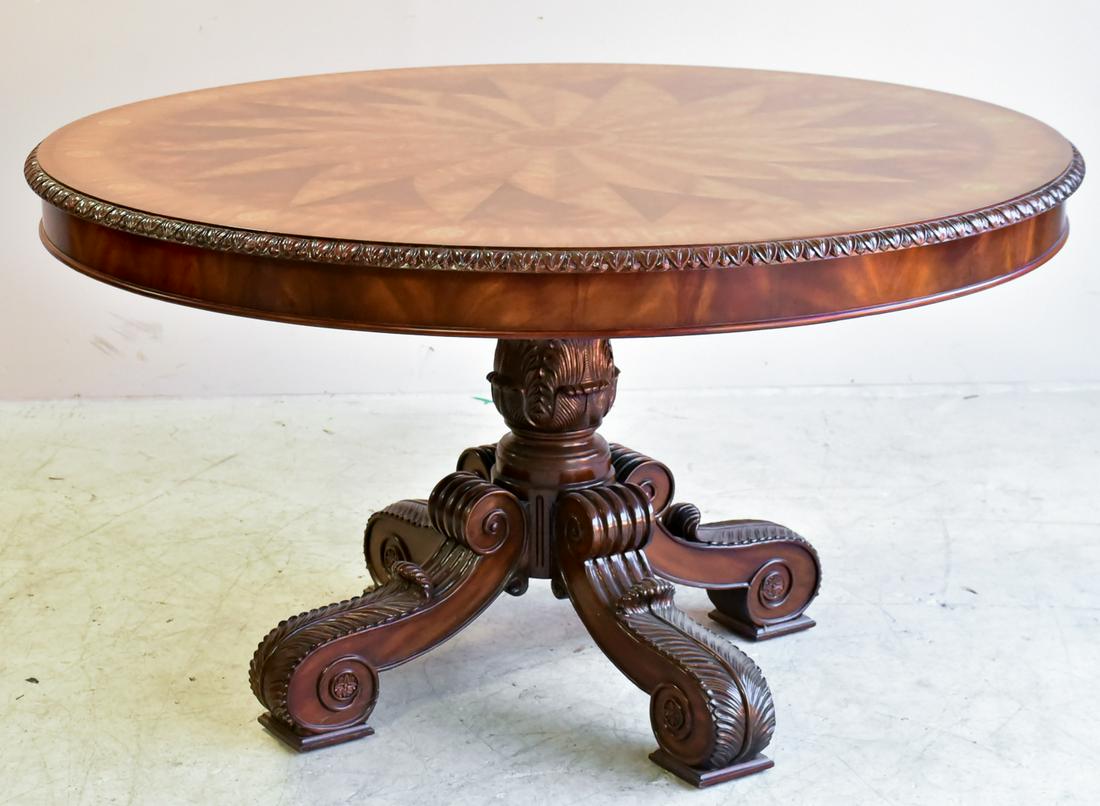 Maitland Smith marquetry inlaid center table: Maitland-Smith center table, 20th c., the circular top with sunburst marquetry inlay rising on a carved pedestal with quadripartite legs on scrolled feet, 30"h, 54"d