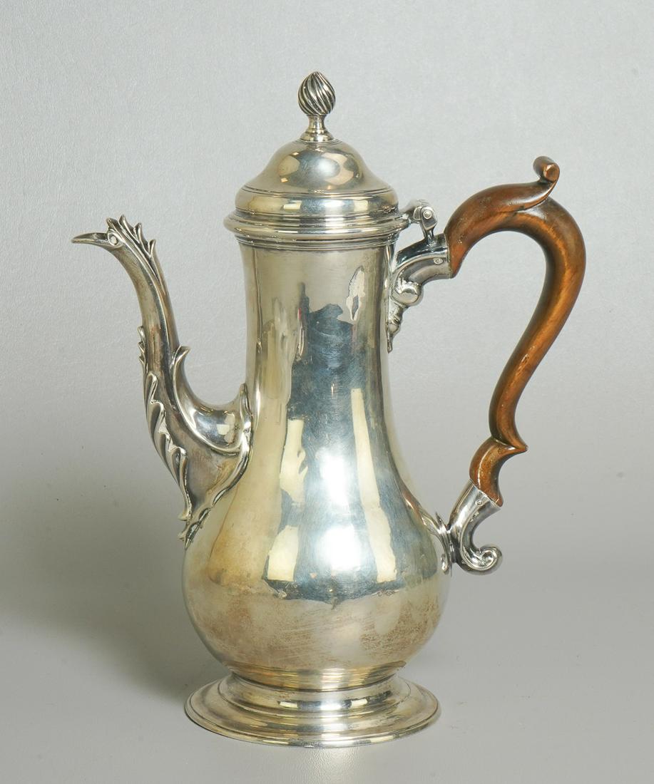 George III Silver Baluster Form Coffee Pot: George III Silver Baluster Form Coffee Pot, spreading foot; featuring a hinged domed lid with spiral ribbed finial; bird's neck spout with cock's comb; and scrolled wood handle, Maker's mark is too wo