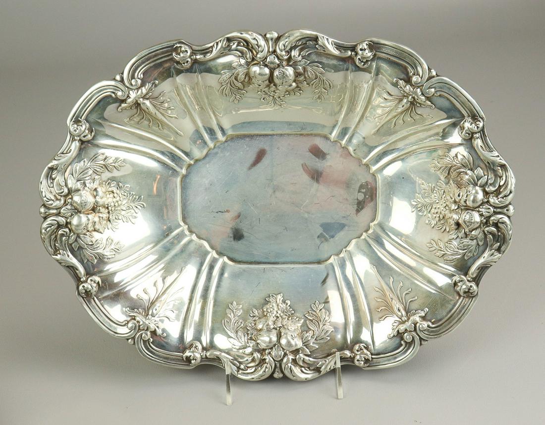 Reed & Barton Sterling Repousse Bread Basket: Reed & Barton sterling repousse bread basket in shell form with scroll, fruit and foliage decorated edge, Francis I pattern, 15-1/2"x11-1/2", 28.7 T.O, Just tarnish marks, rubs right off. No damage, s