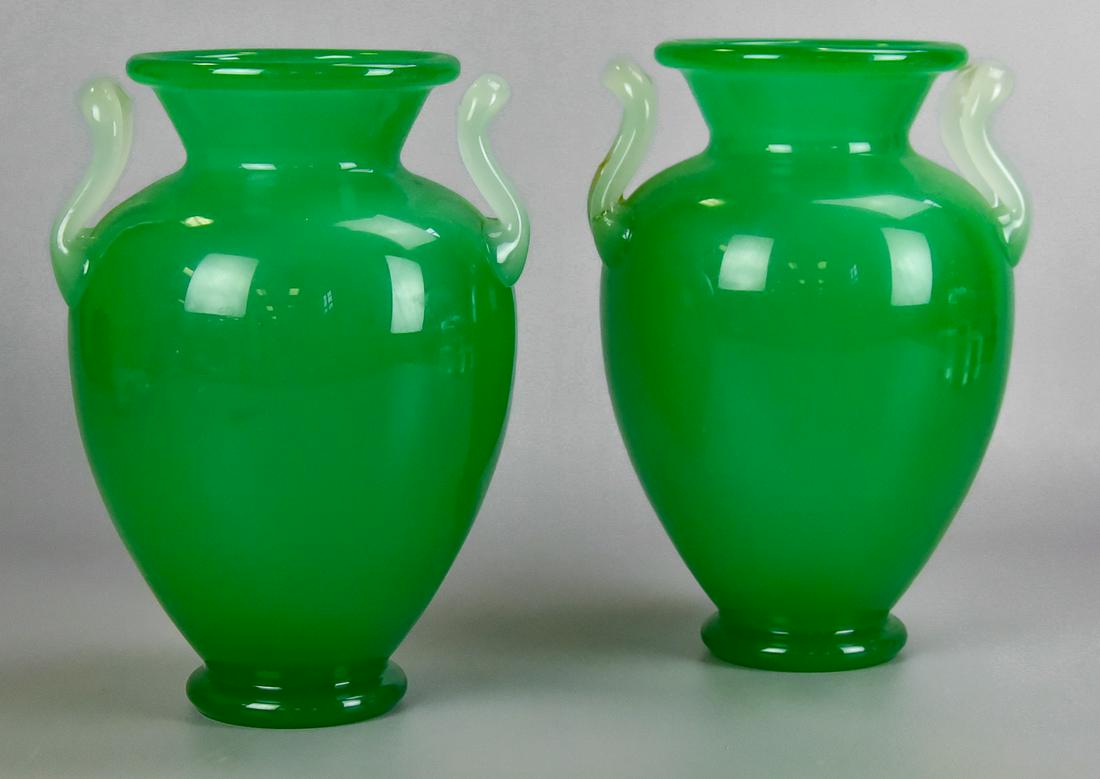 Pair of Steuben Jade Green Glass Vases: Pair of Steuben glass vases, jade green baluster form with clambroth handles (one handle repaired and part of body where handle meets), 10-1/4" h x 6-1/2" dia, Vase with cracked off handle and damage