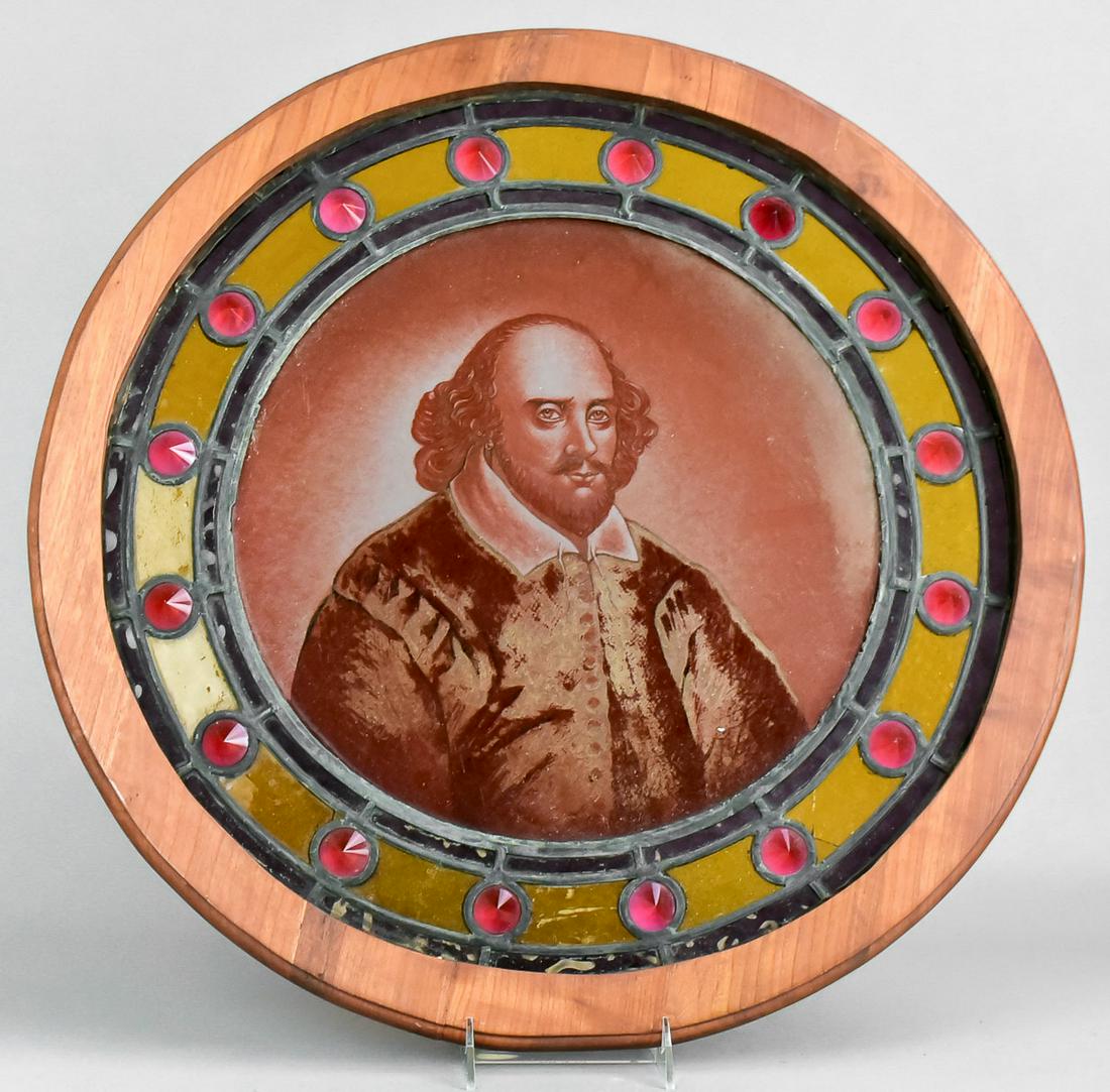Shakespeare Reverse Painted Stained Glass Window: Shakespeare reverse painted stained glass window, glass center with reverse painted portrait at center, in pieced black and amber glass border with ruby glass diamond formed studded trim, in wood fram